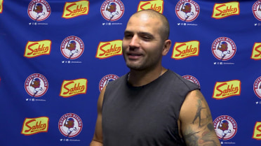 Joey Votto talks to the media before the game