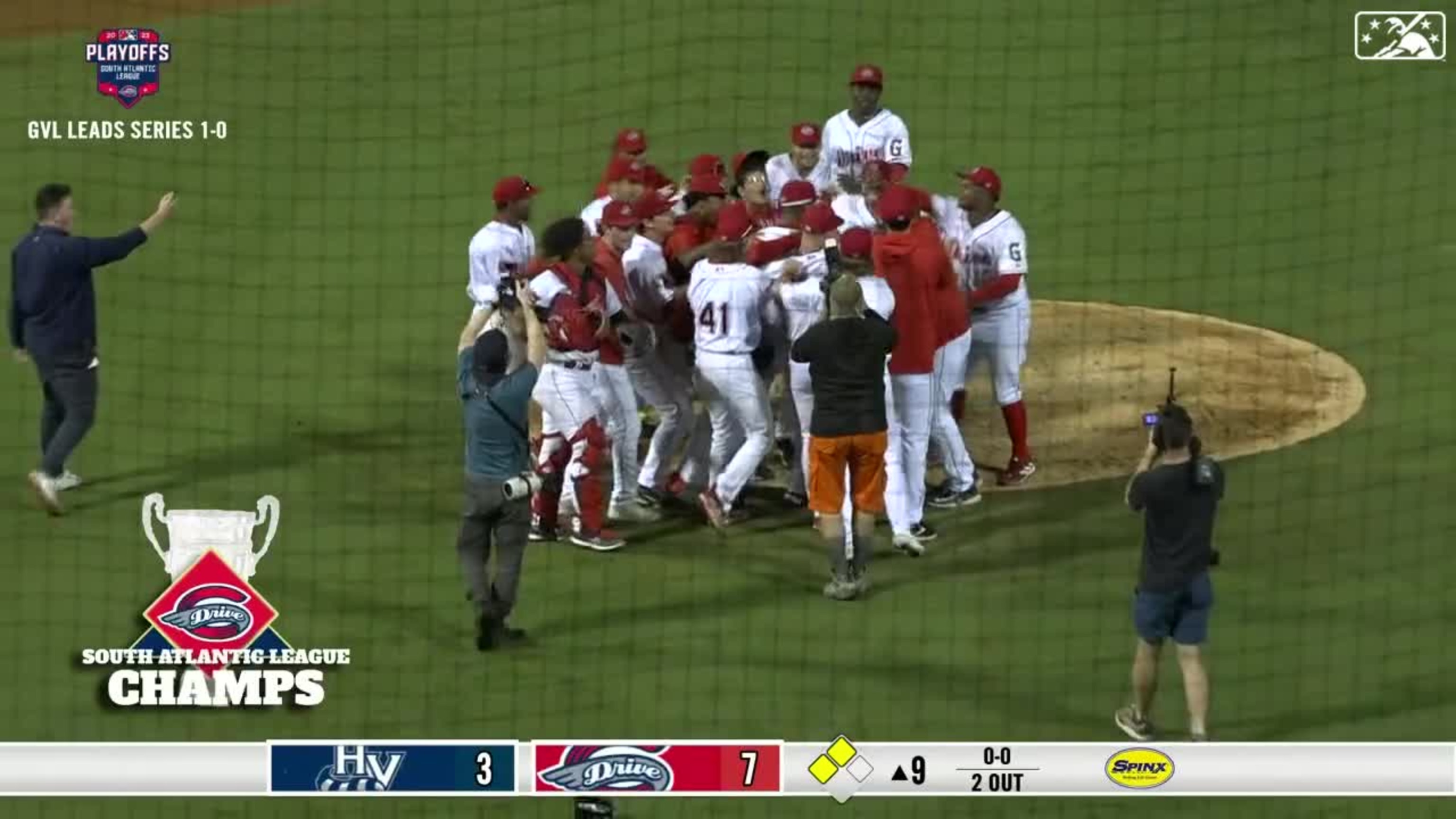 Manager Iggy Suarez of the Greenville Drive talks with his team before the  celebration in the clubhouse following the South Atlantic League  Championship game against the Hudson Valley Renegades on Tuesday, September