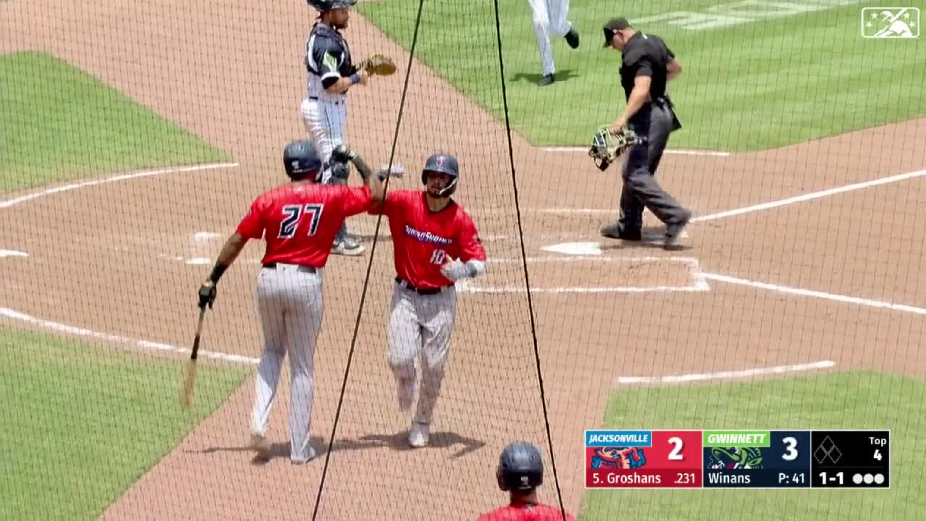 Jordan Groshans of the Miami Marlins walks off the field between