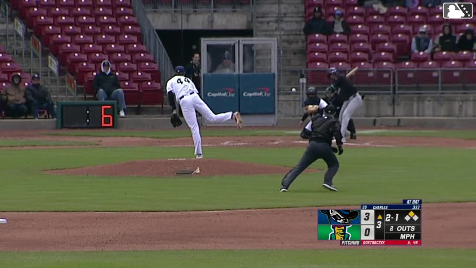 Austin Charles singles on a line drive to left fielder Jaime Ferrer ...