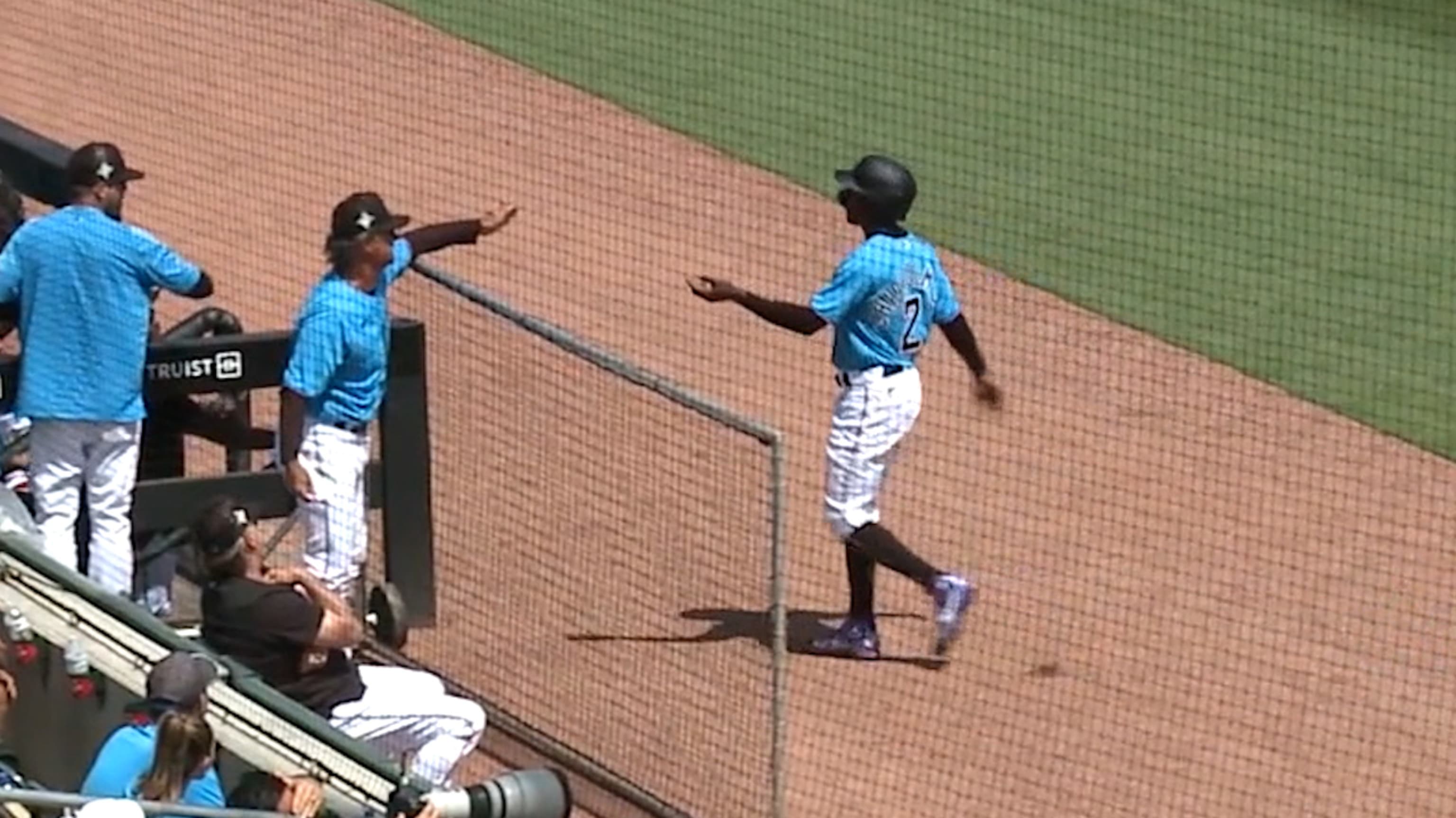 Marlins outfielder Juan Pierre bunting for a hit.