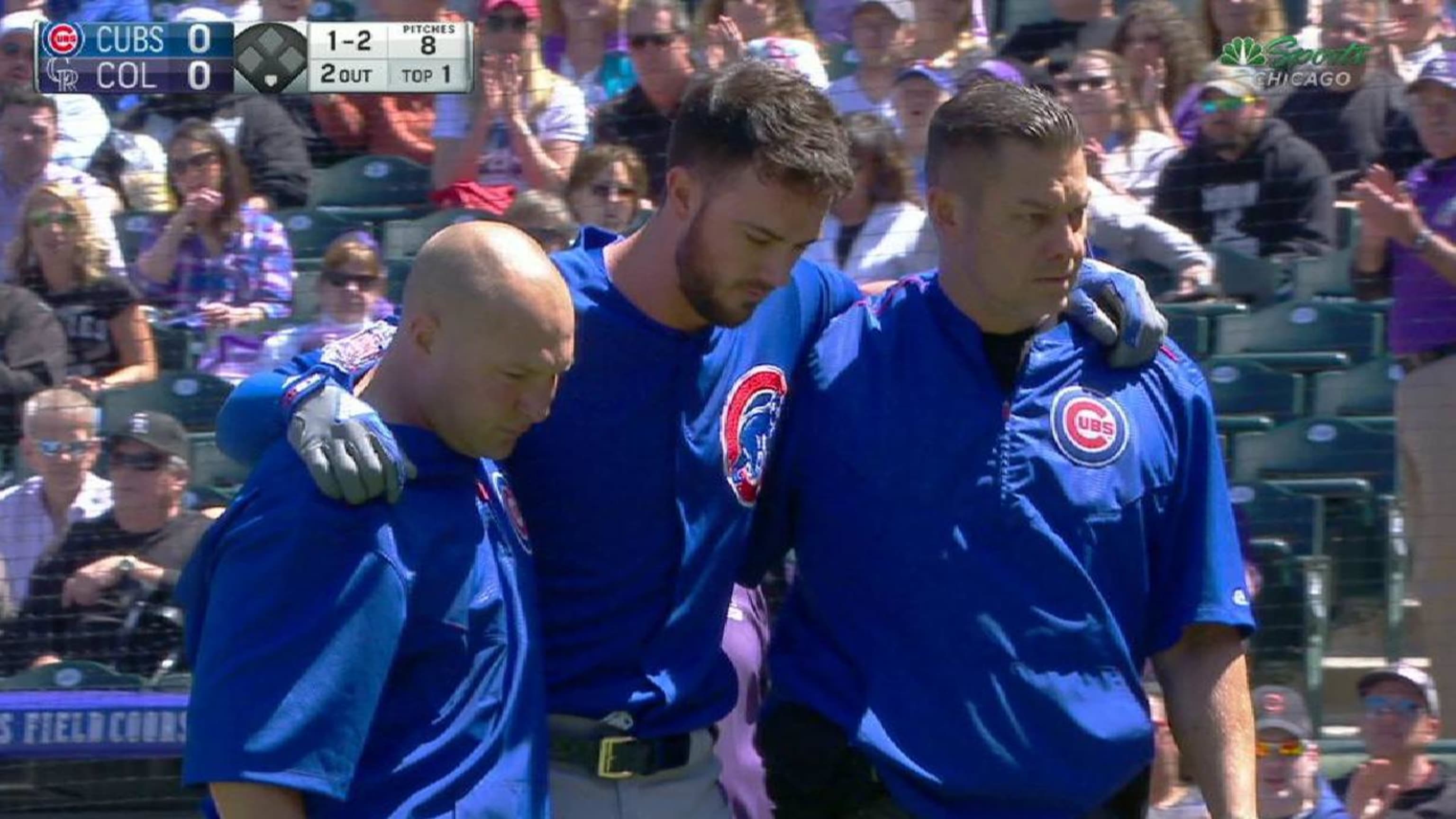 Chicago Cubs Kris Bryant falls to the ground after throwing to