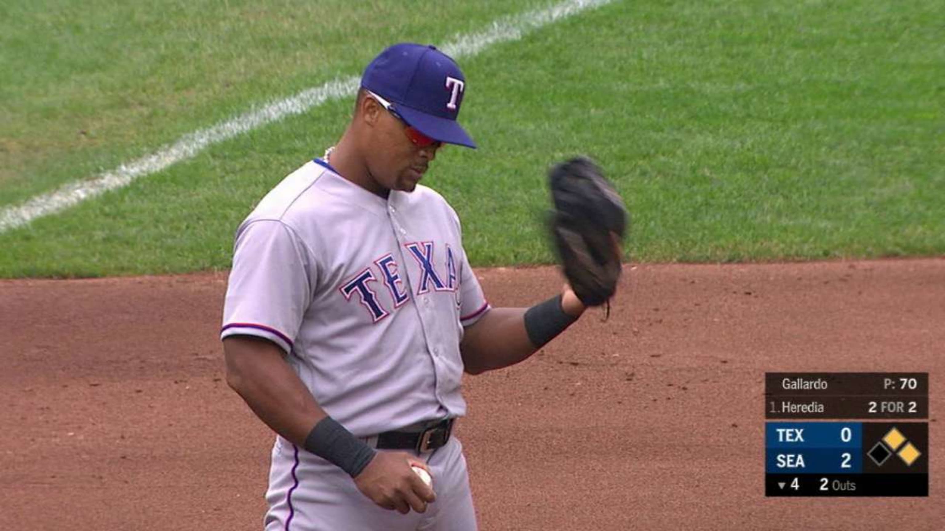 Seattle Mariners' Adrian Beltre smiles at teammate in the dugout