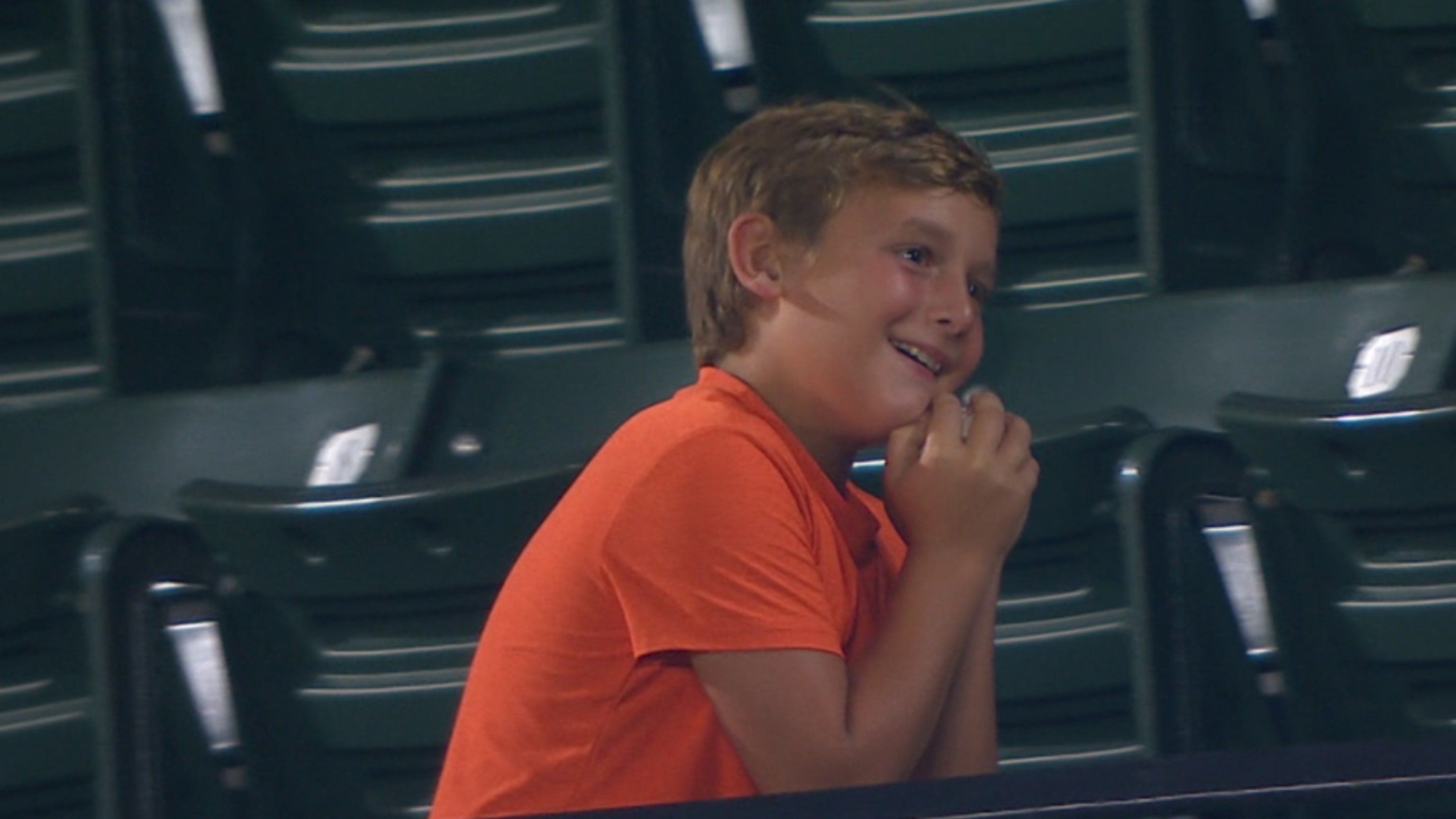 Baby Orioles fan couldn't decide if he wanted this foul ball or not