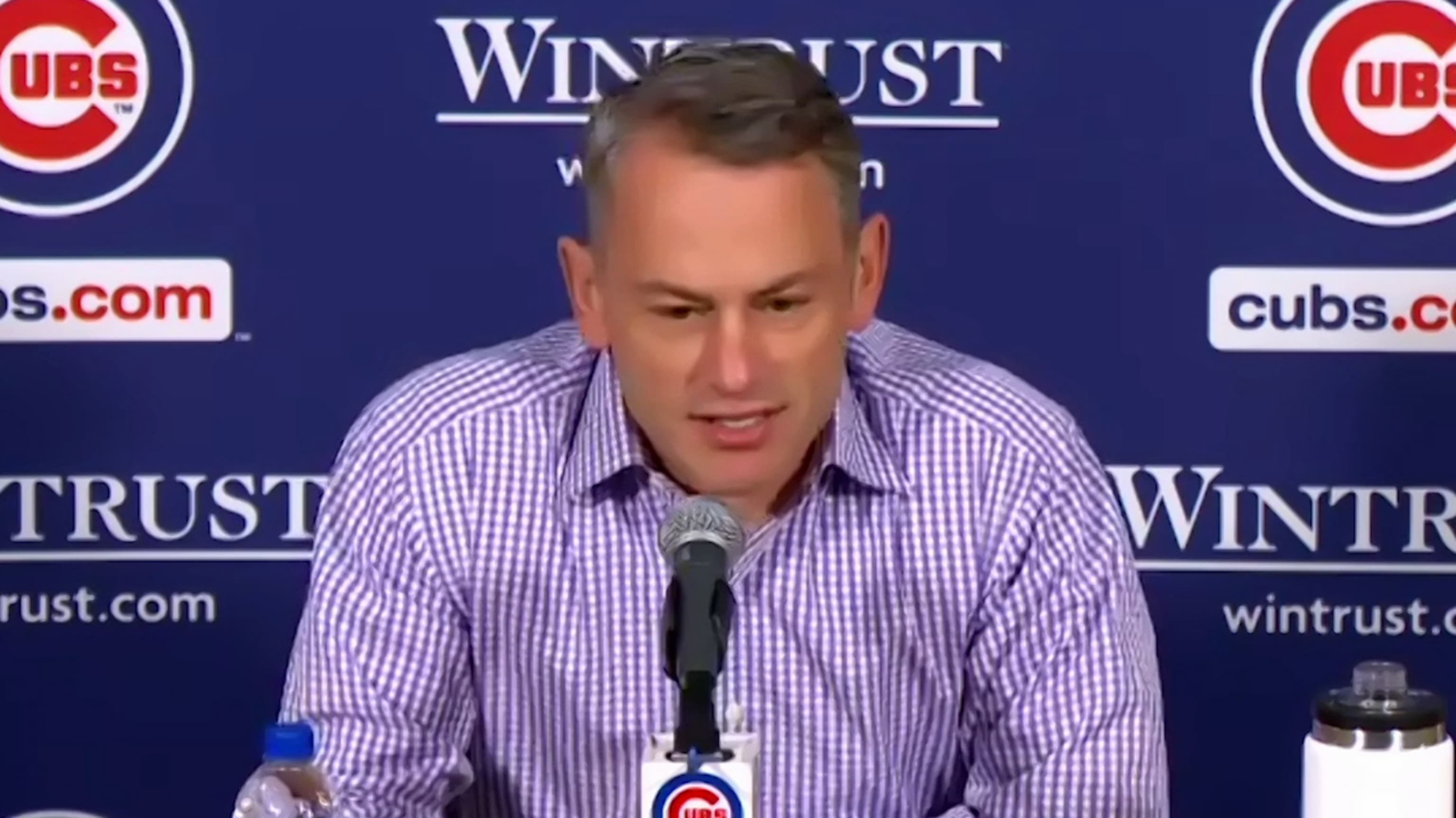 President Jed Hoyer of the Chicago Cubs presents a jersey to