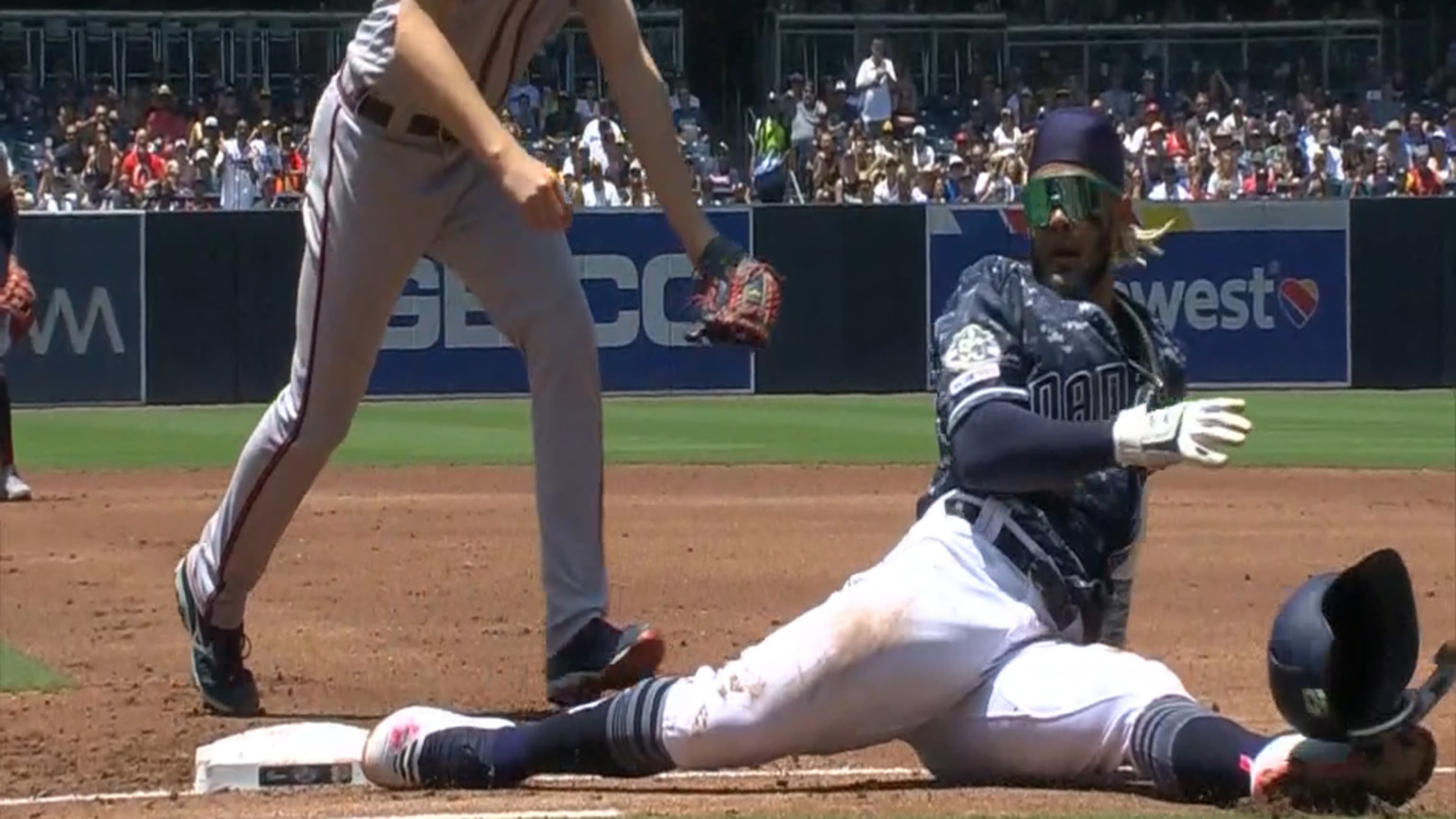 Download Fernando Tatis Jr Celebrates after Sliding Safely into