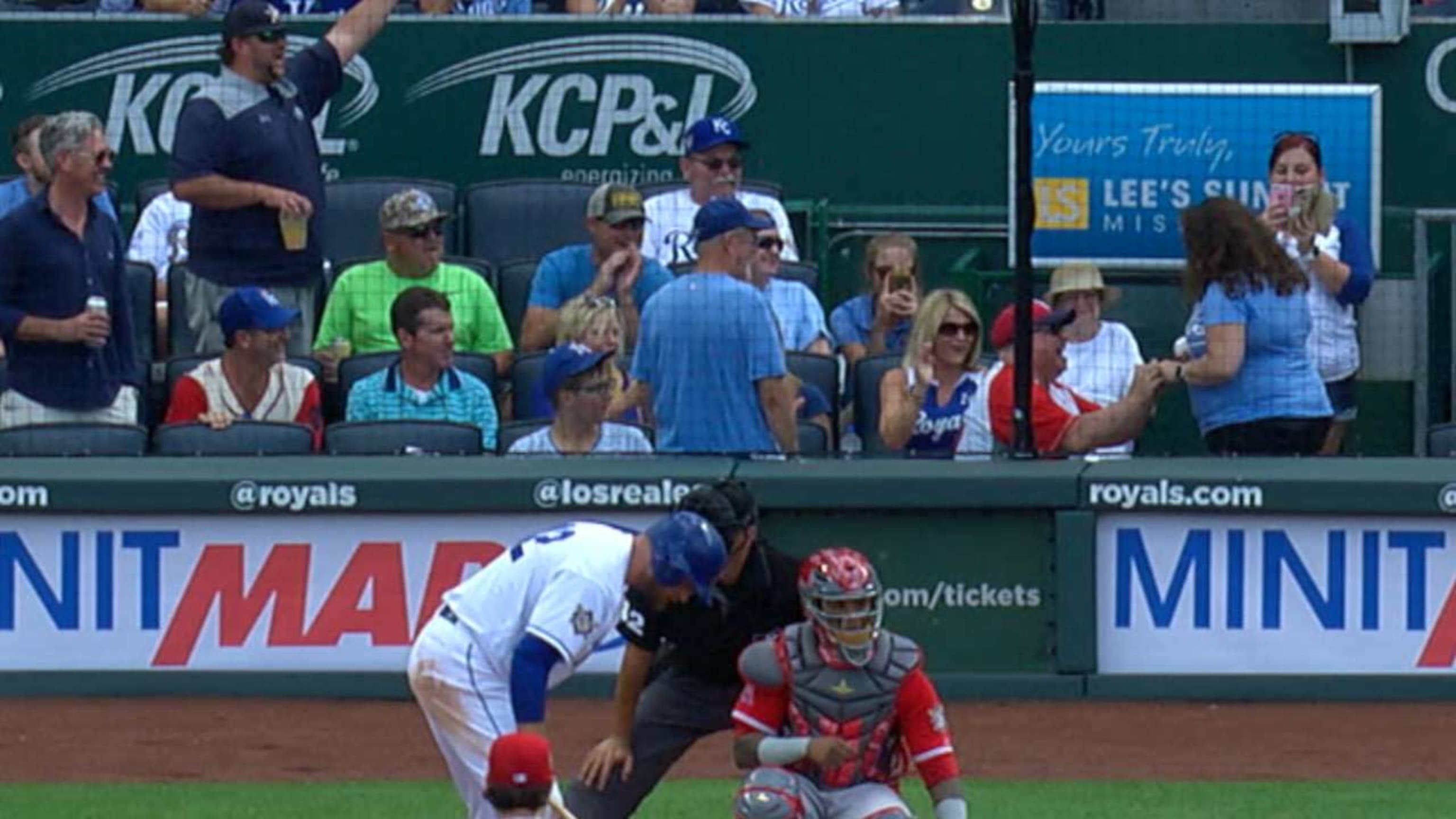 An Angels fan in a Mike Trout jersey proposed to his Royals fan