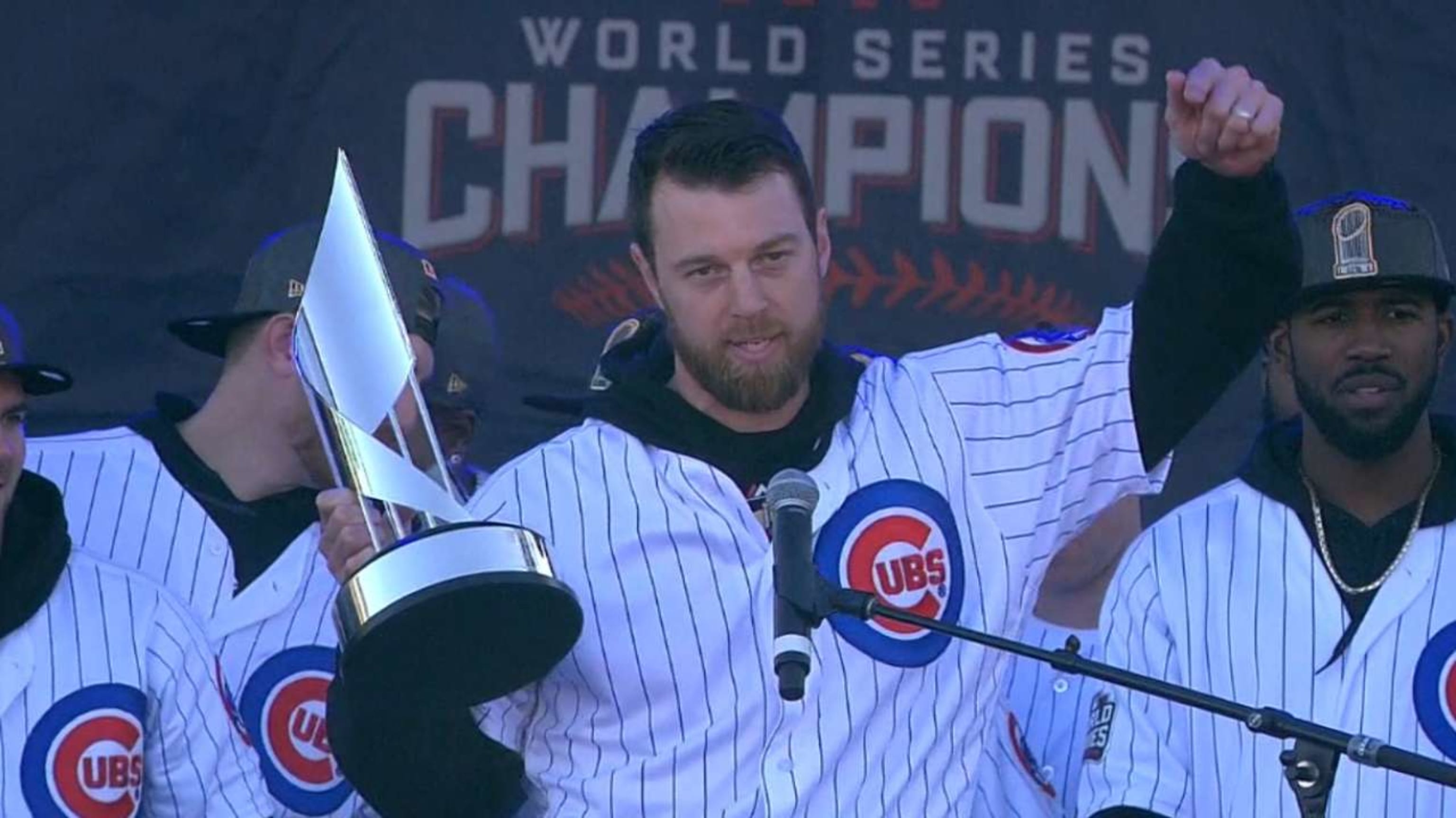 Chicago Cubs' Ben Zobrist holds the World Series MVP Trophy as he arrives  on stage during the 2016 World Series Champion celebration rally at the  Grant Park on November 4, 2016 in