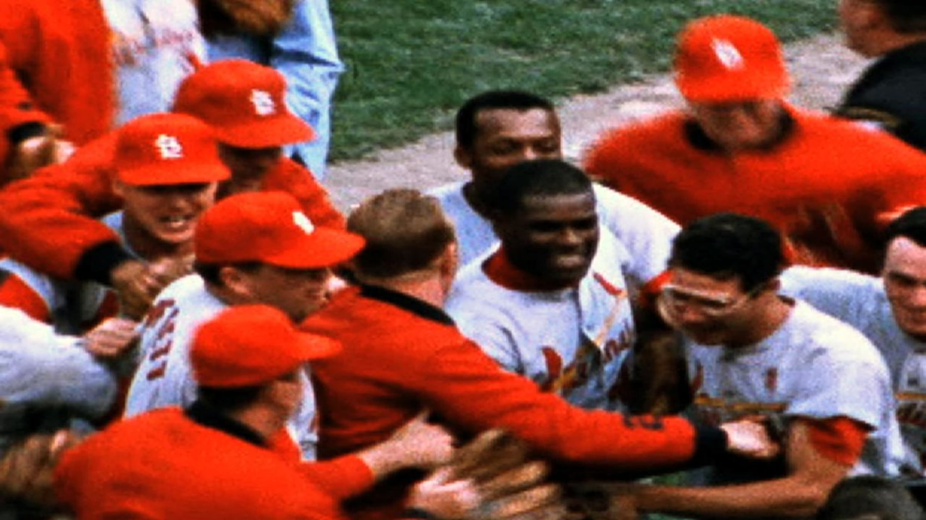 Bob Gibson hits a home run and strikes out 10 batters in leading the