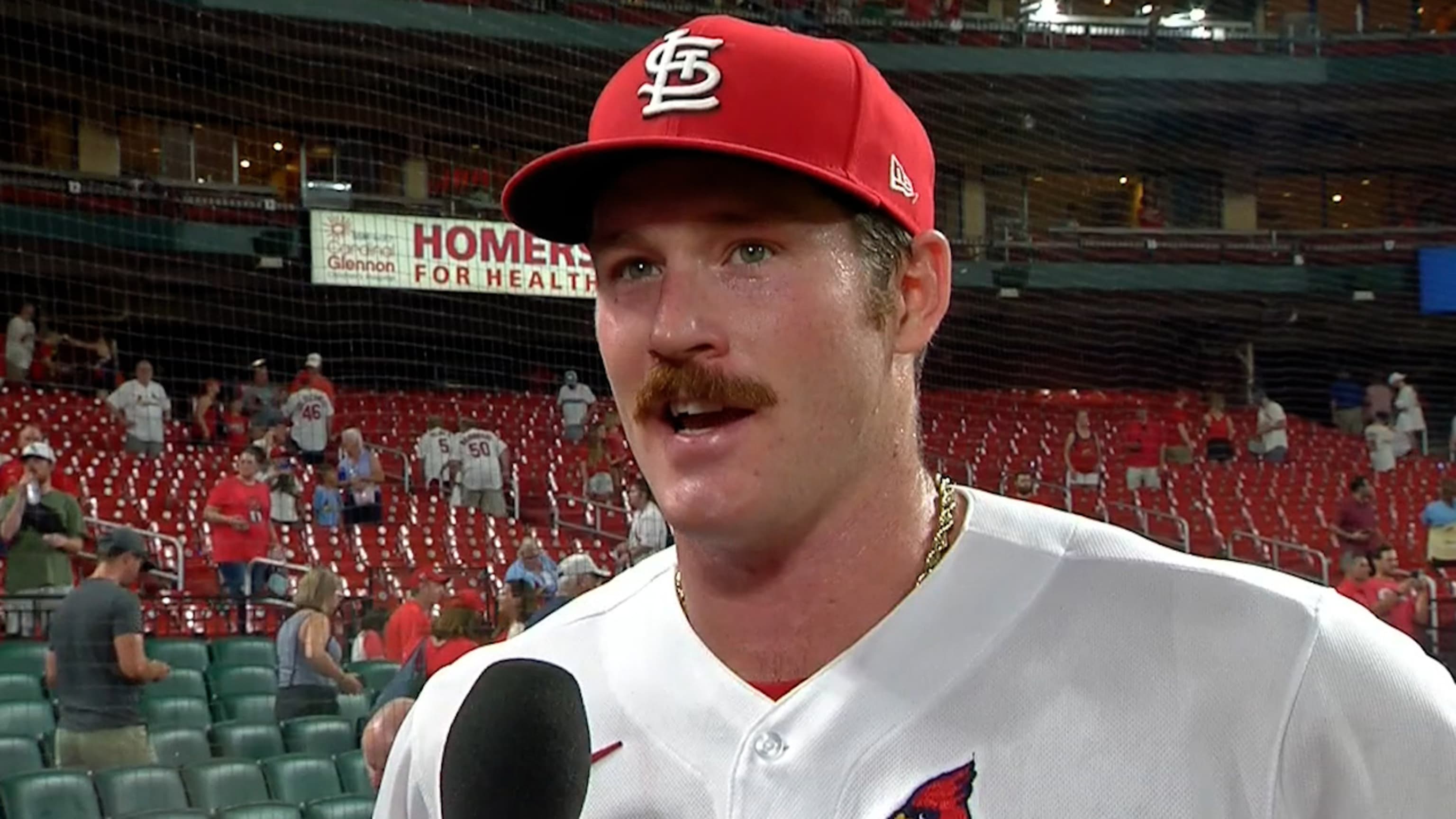 Miles Mikolas of the St. Louis Cardinals splashes water on his