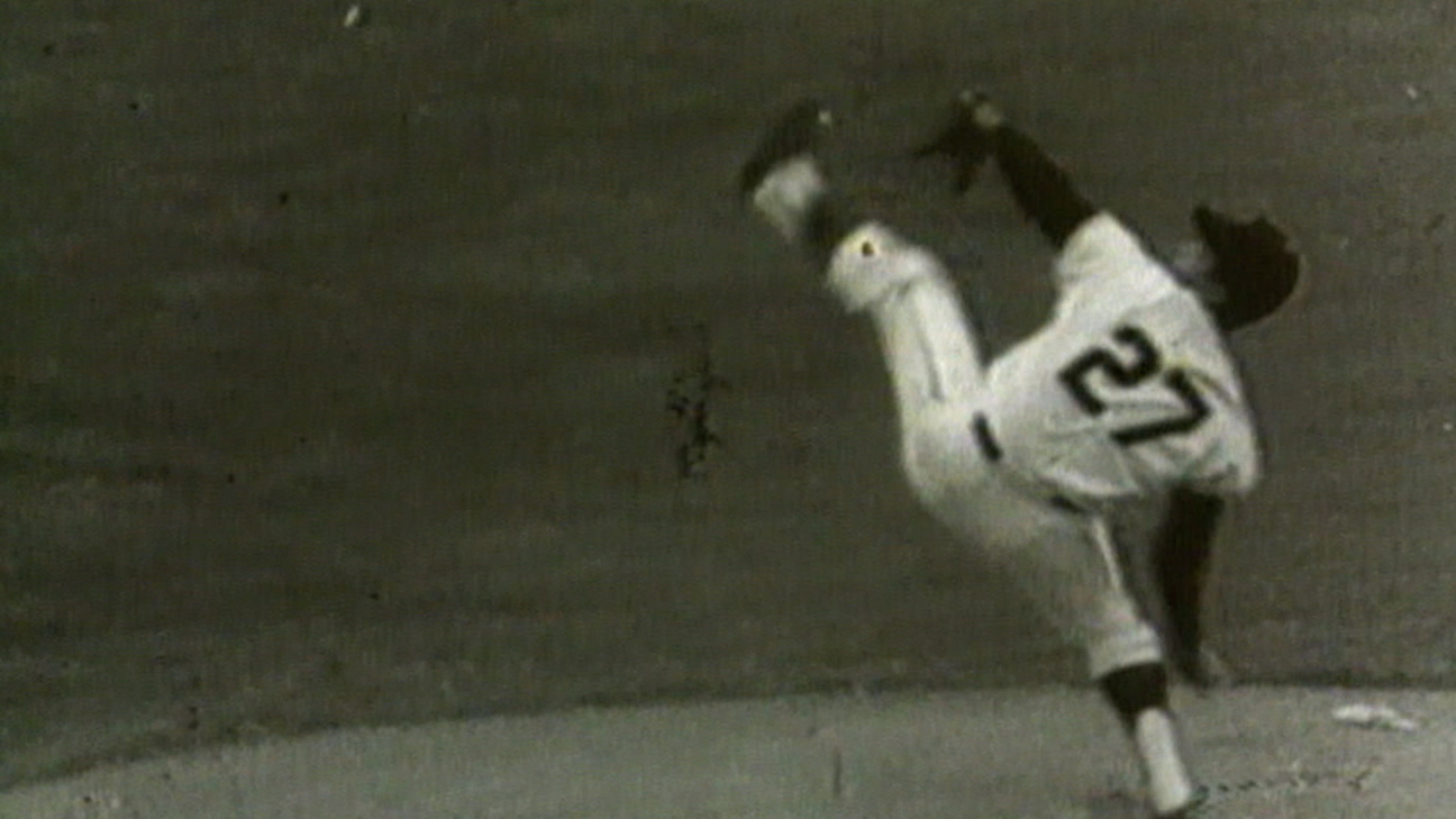 Warren Spahn of the Milwaukee Braves pitches during an Major