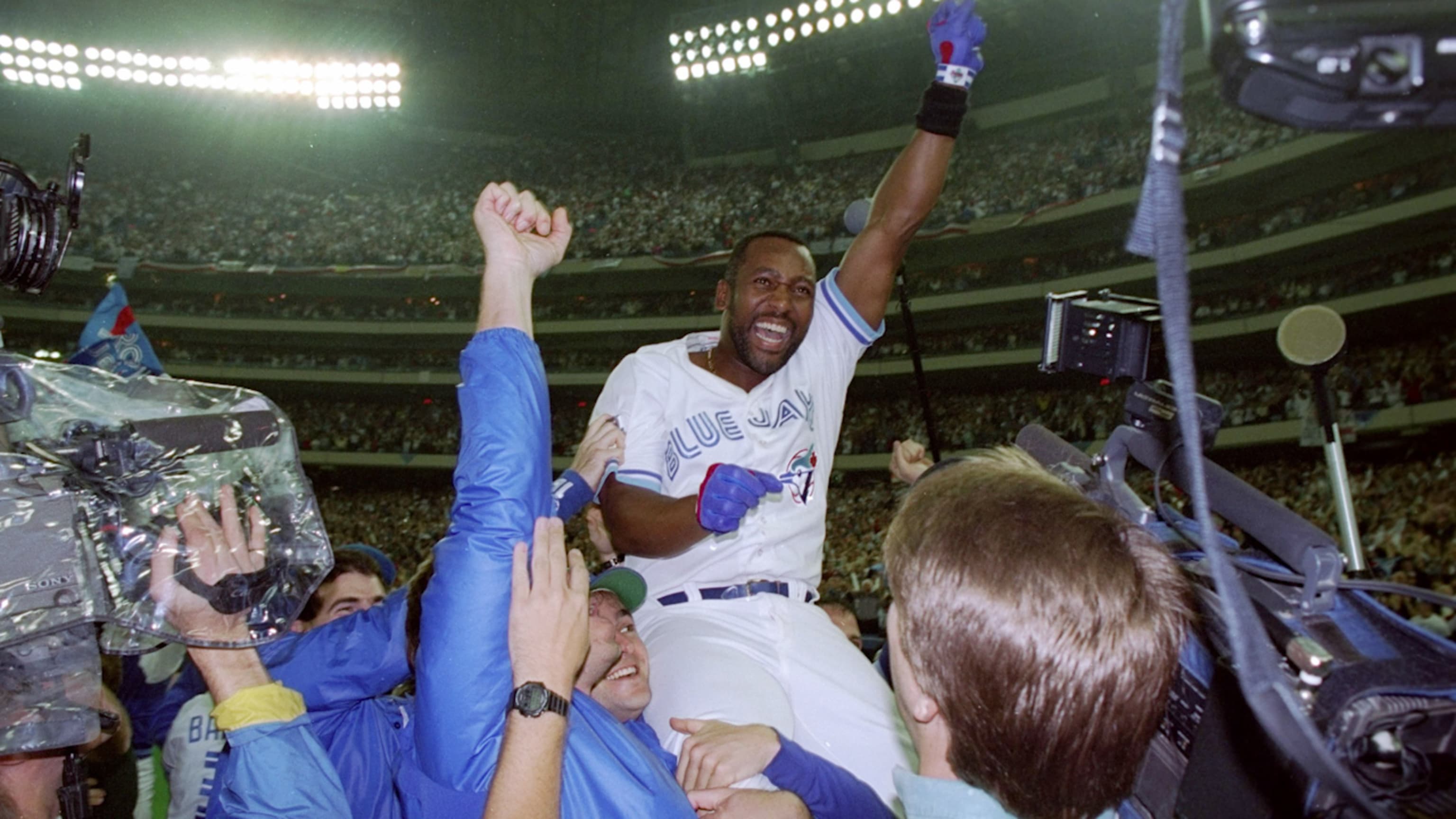 Toronto Blue Jays' Rickey Henderson celebrates after scoring the winning  run on a Devon White triple in Game 4 of the World Series against the  Philadelphia Phillies on Oct. 20, 1993, in