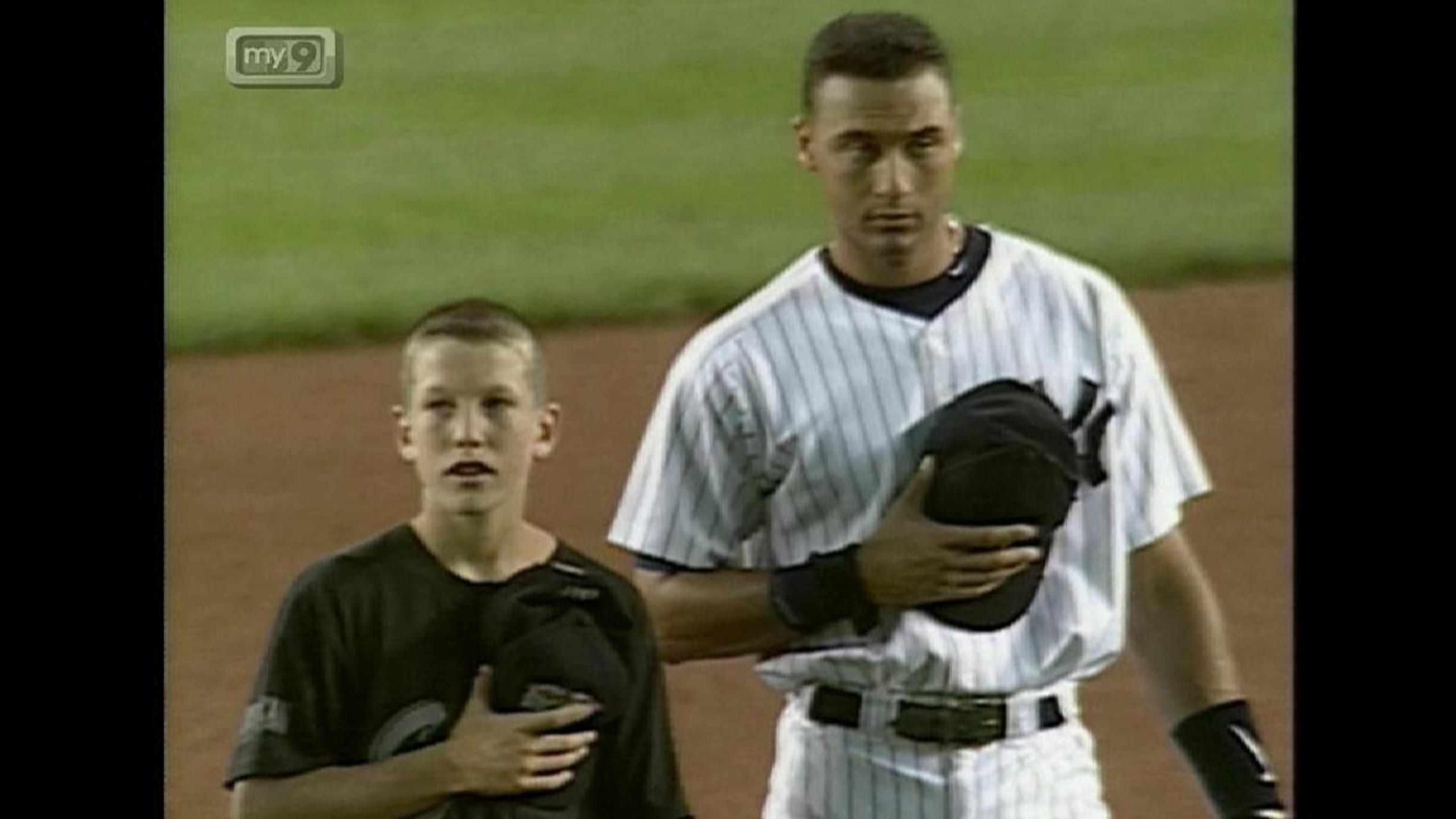 New York Yankees Derek Jeter stands on first base with Cincinnati