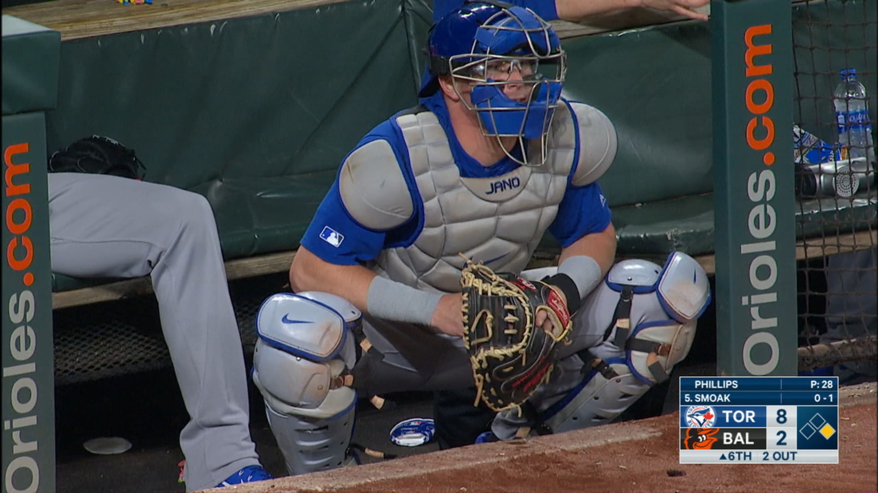 Trent Thornton blocks foul balls in dugout