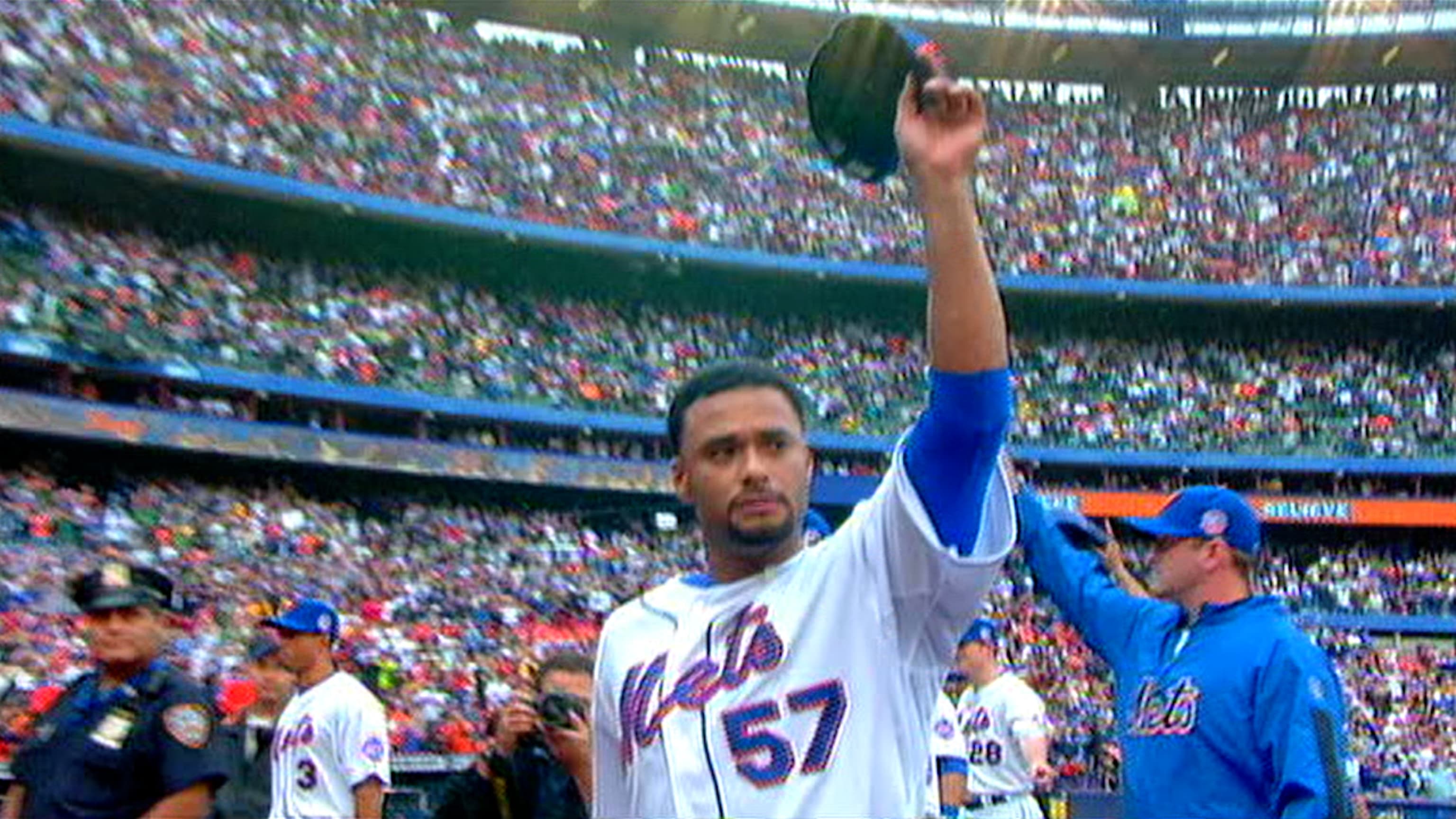 Johan Santana (C), a two-time Cy Young award winner, is joined by his wife  Yasmile and father Jesus as the New York Mets announce the acquisition of  the left-hand pitcher at Shea