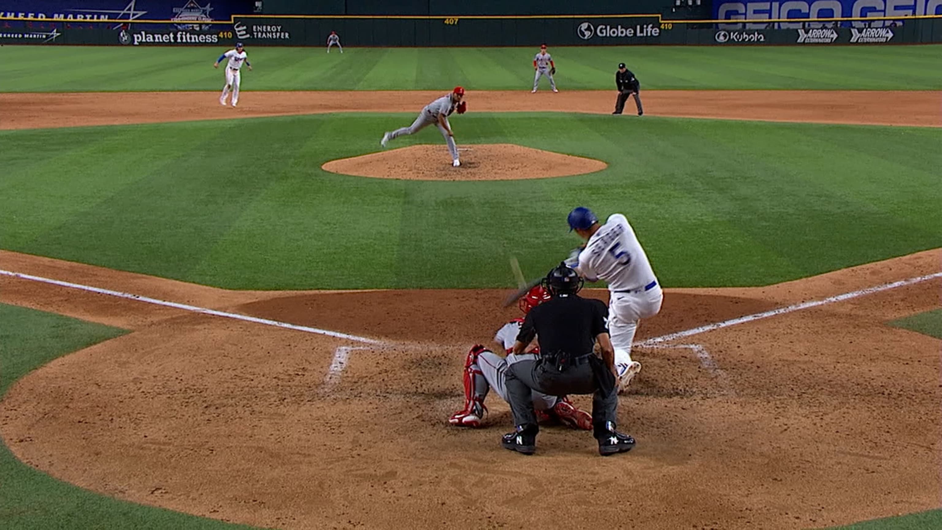 Randal Grichuk takes a homer away from Corey Seager 