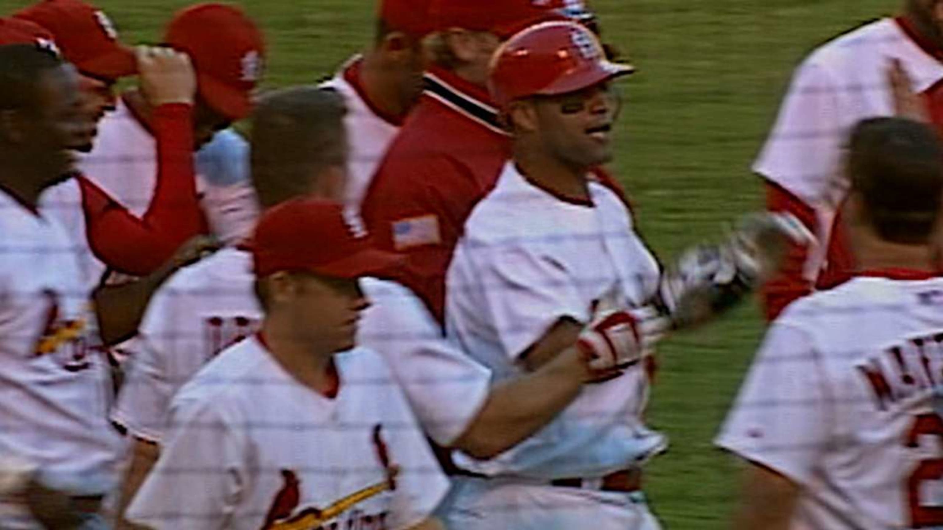 Pujols walks off Cards in 13th