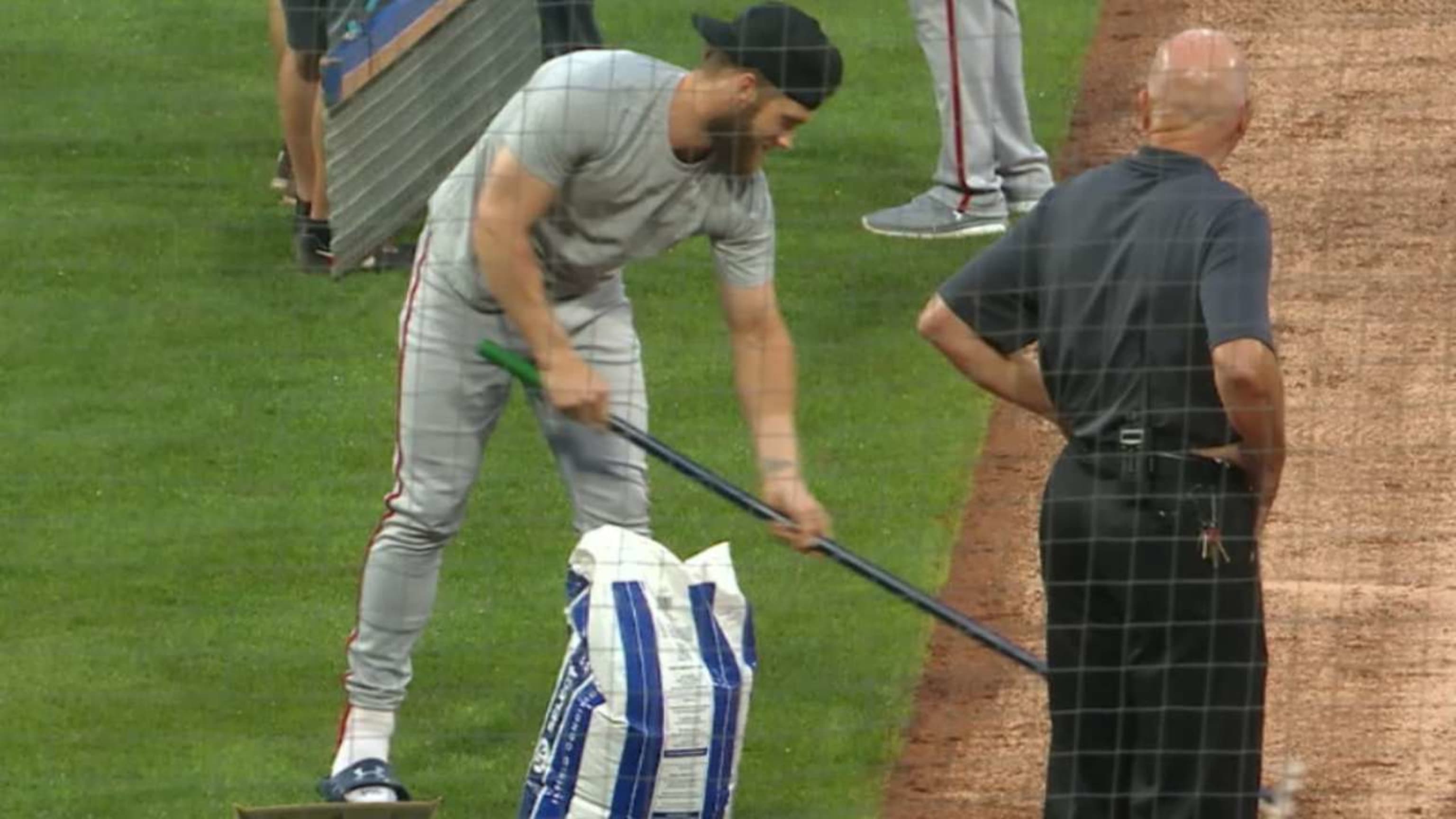 Phillies grounds crew uses blowtorch on field