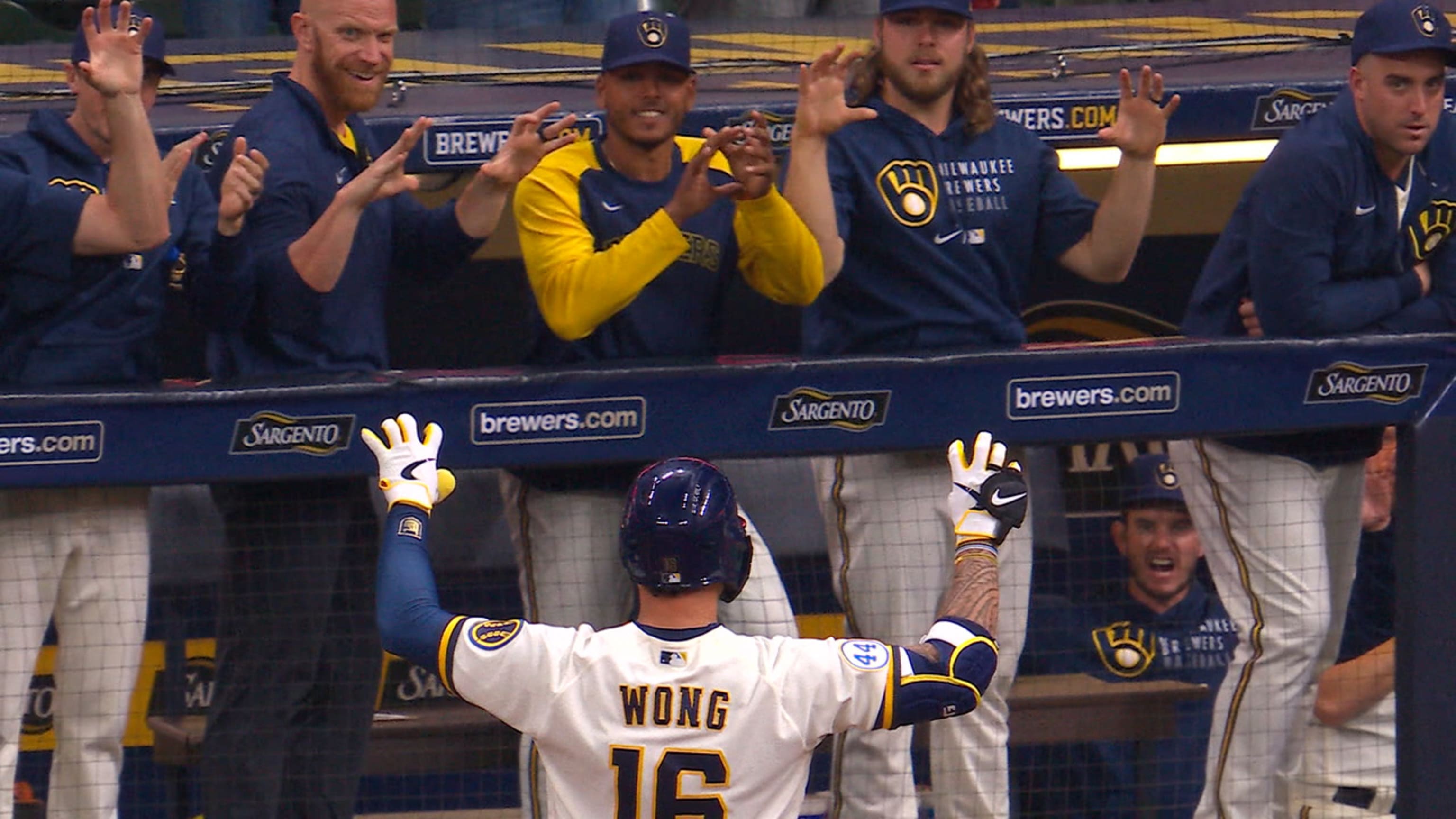 Manny Pina of the Milwaukee Brewers tries to rip off the shirt of News  Photo - Getty Images