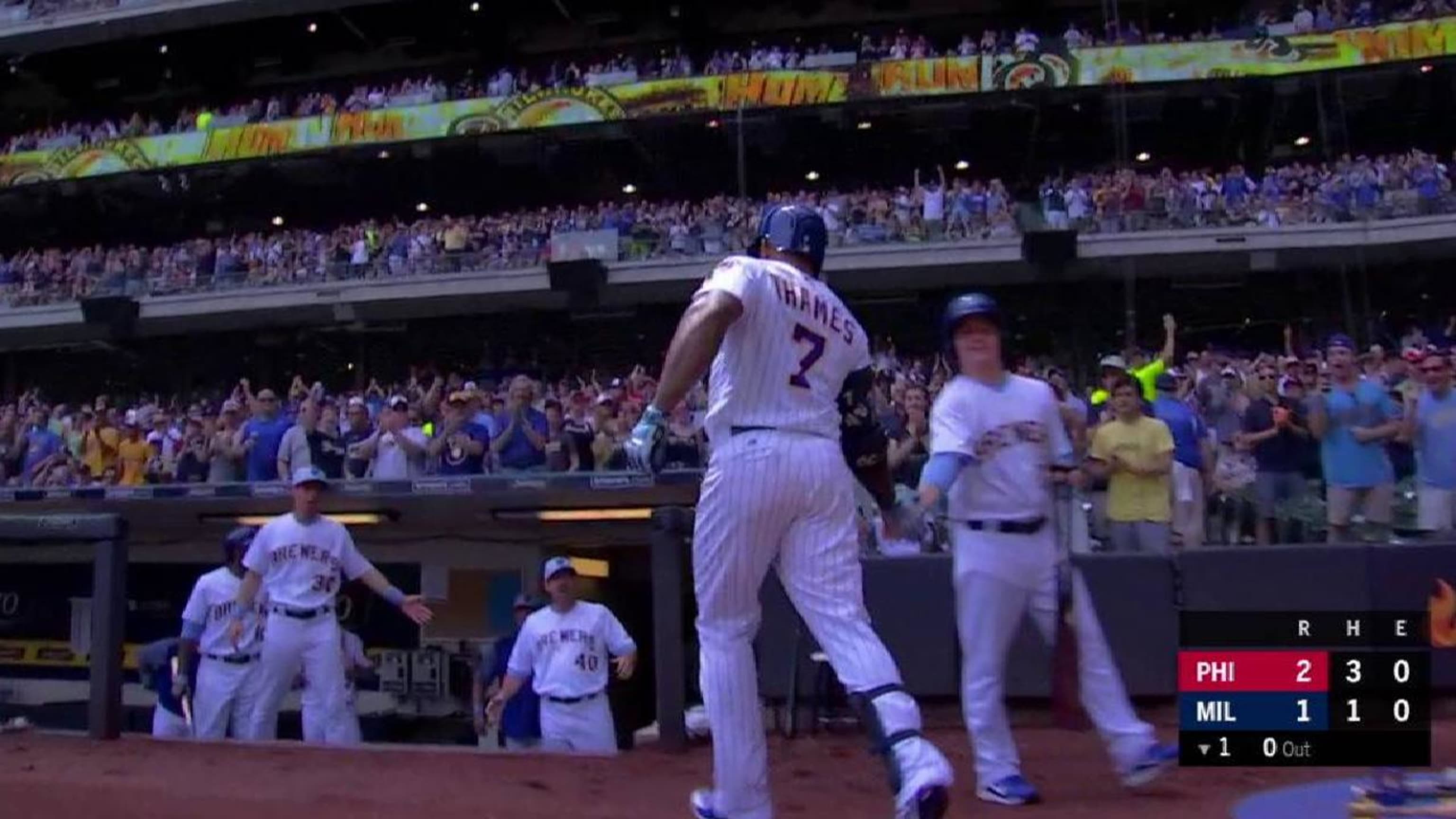 Milwaukee Brewers' Eric Thames stands in the dugout in the fourth