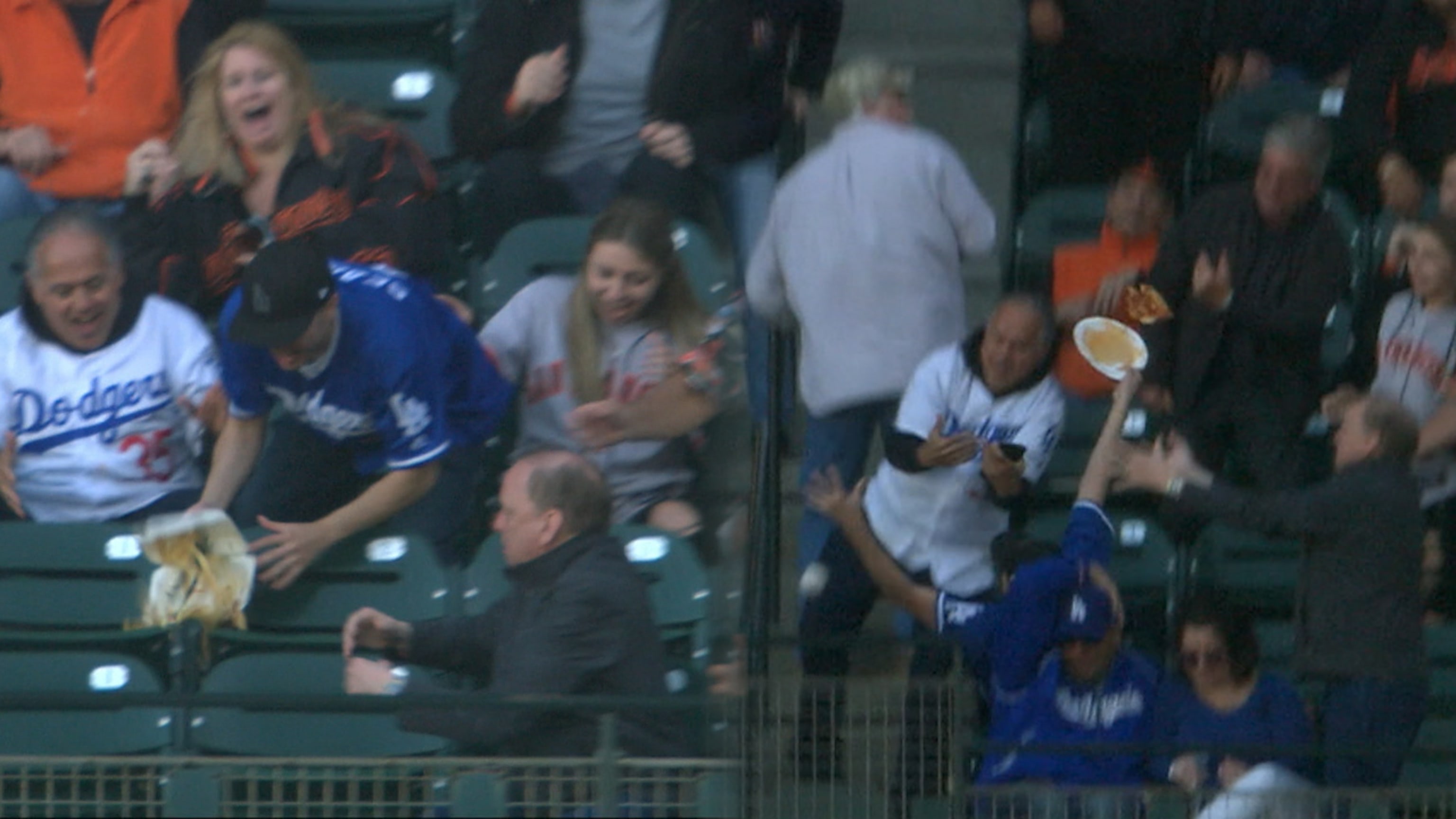 Dodgers fan catches foul ball at Sunday's baseball game while juggling baby  and a beer, viral video shows - ABC7 Los Angeles