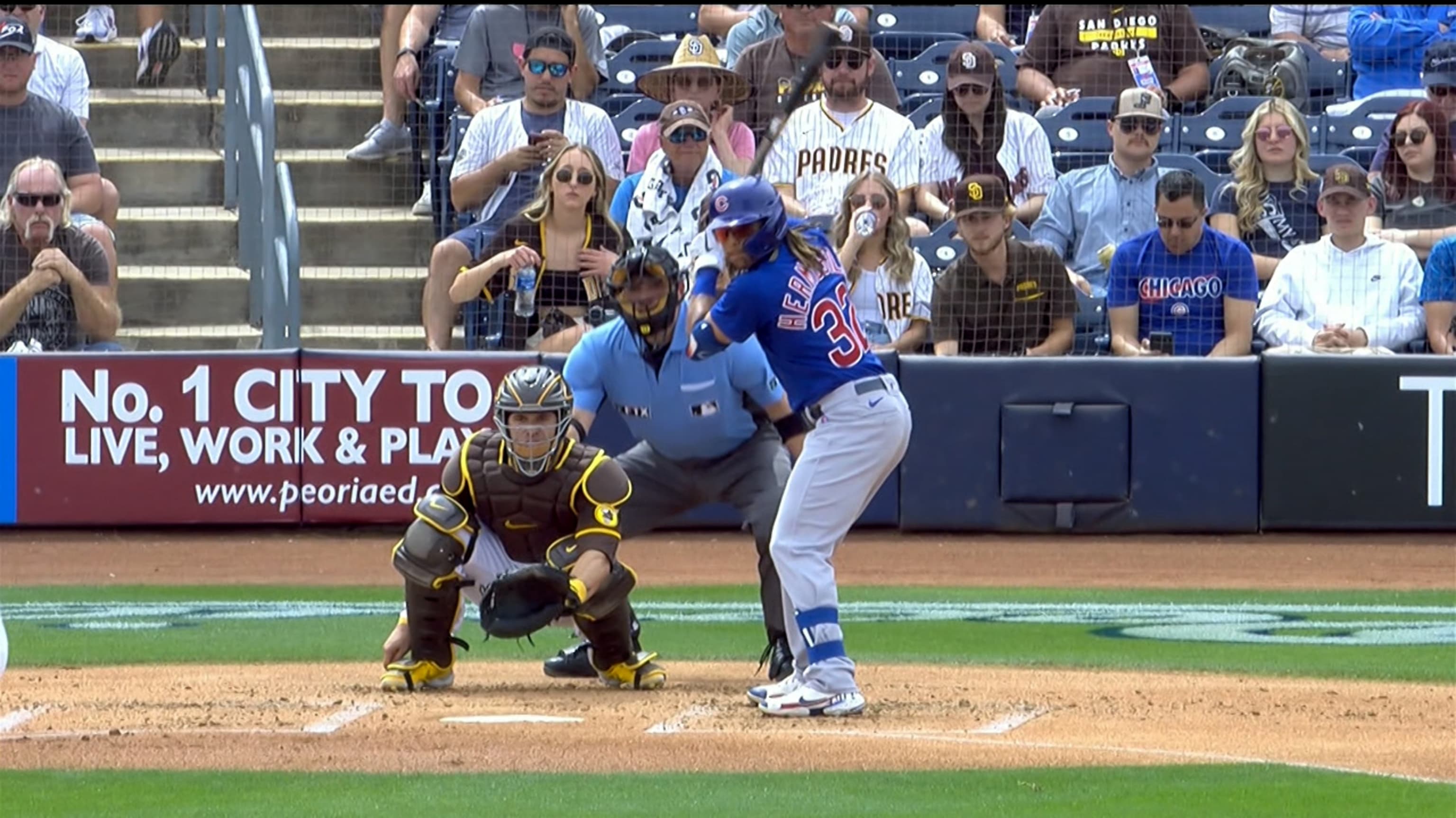 PEORIA, AZ - MARCH 26: Chicago Cubs outfielder Michael Hermosillo (32)  reaches home safely during the MLB Spring Training baseball game between  the Chicago Cubs and the San Diego Padres on March