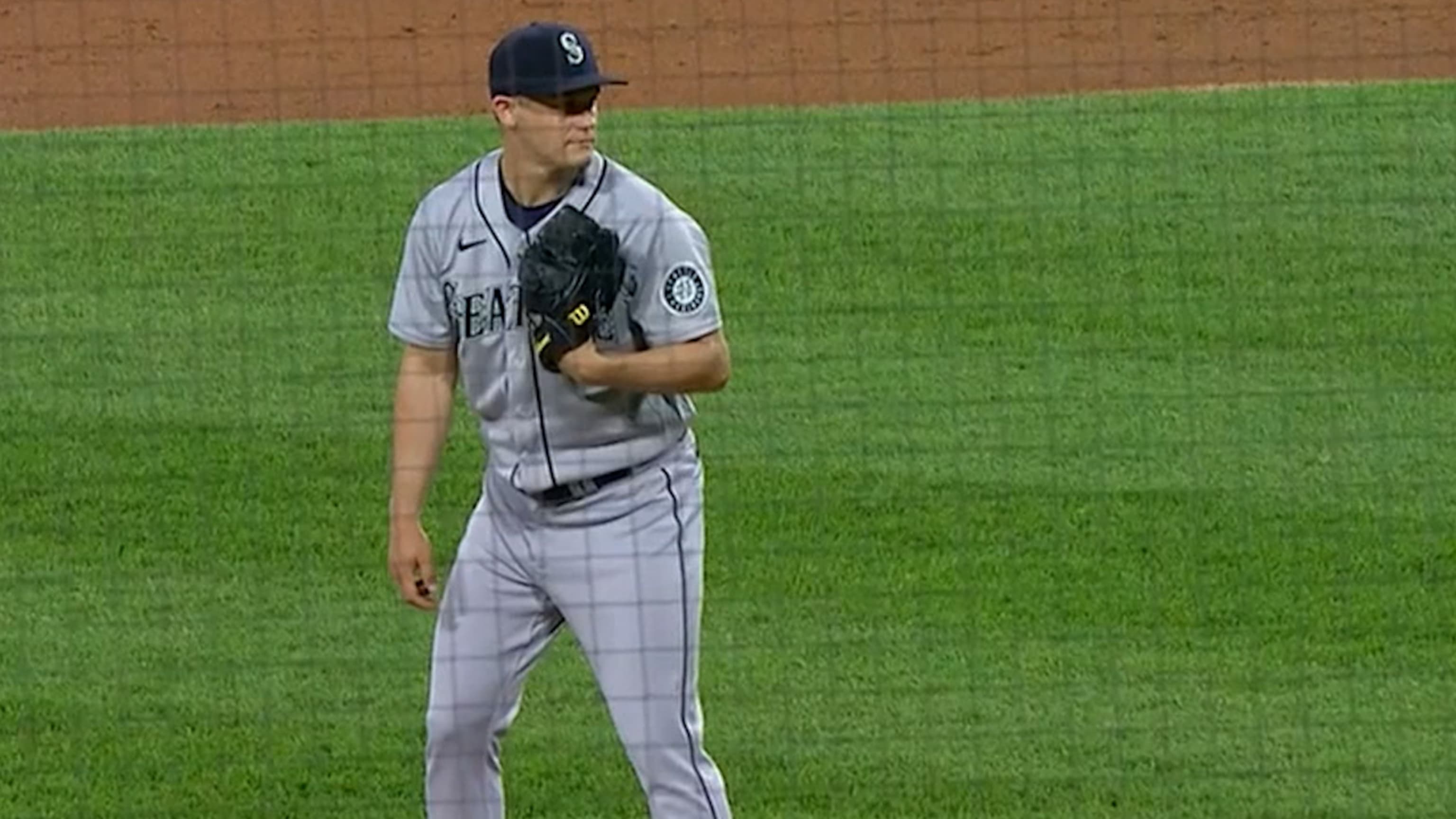 Seattle Mariners relief pitcher Paul Sewald stands between