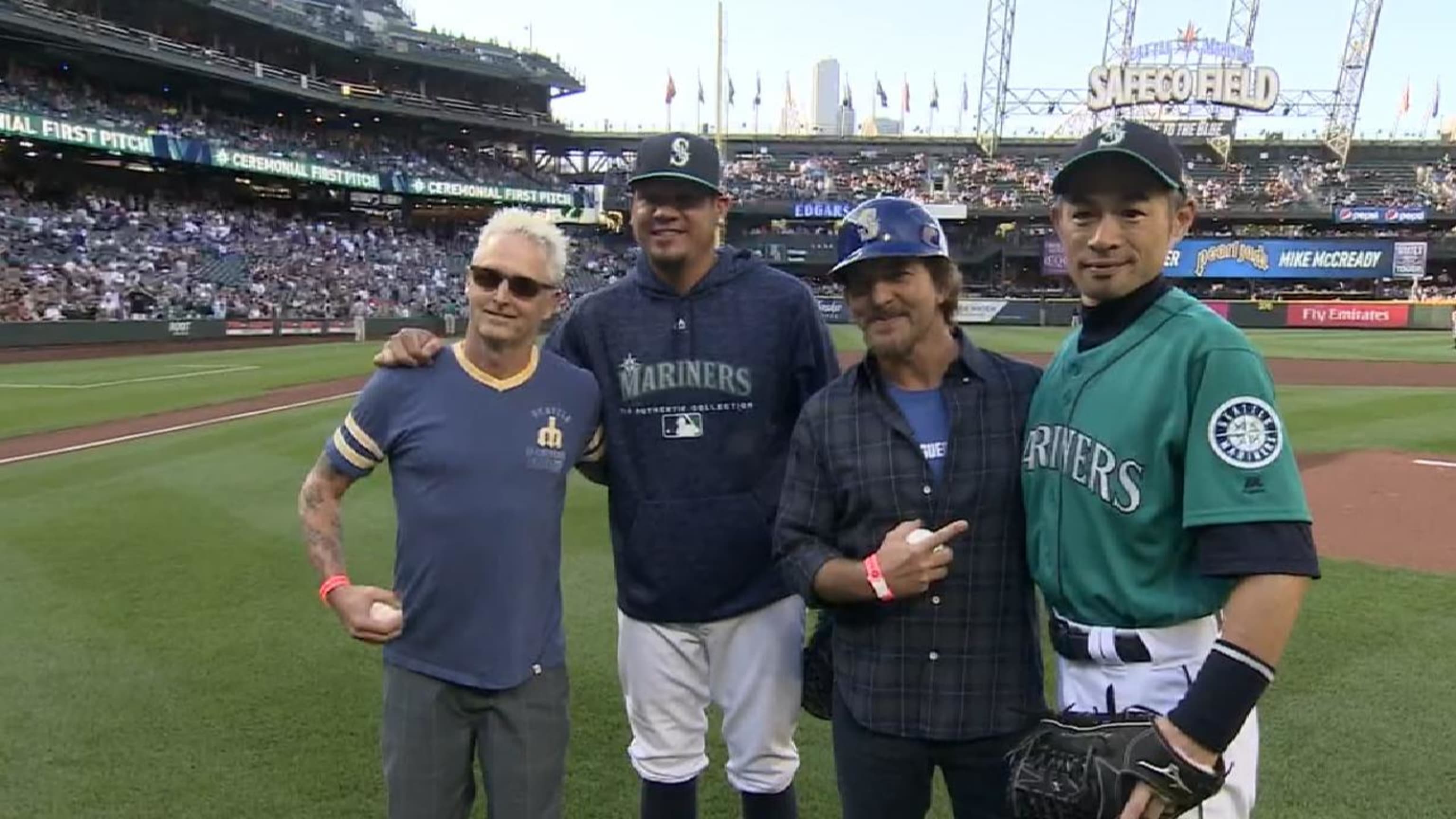 Eddie Vedder wore a batting helmet to throw a first pitch for the