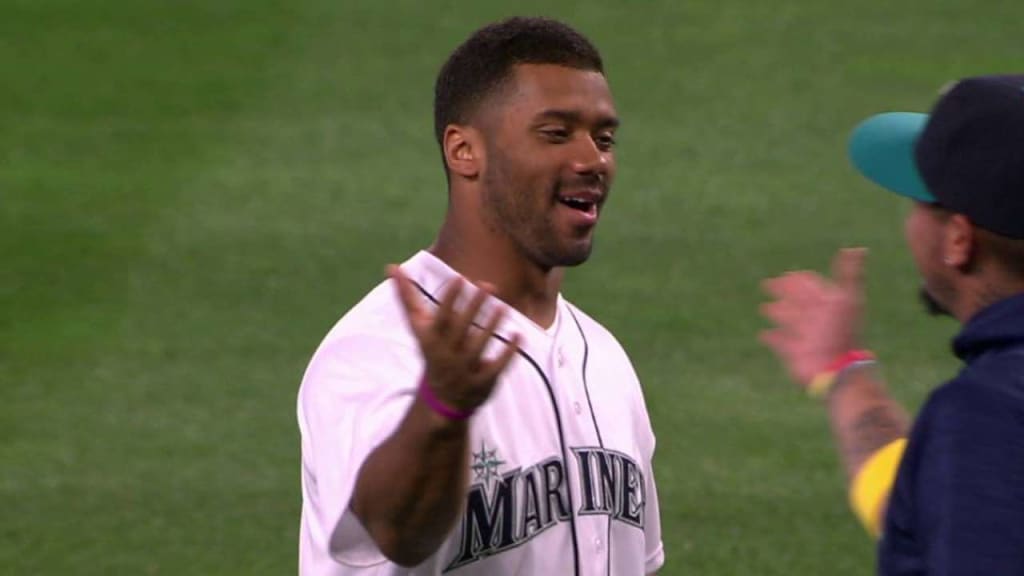 Russell Wilson throws first pitch at Rockies Opening Day