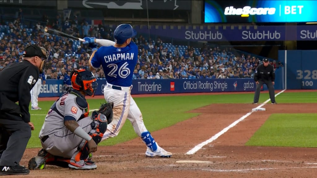 Toronto Blue Jays' Matt Chapman (26) follows through on a home run