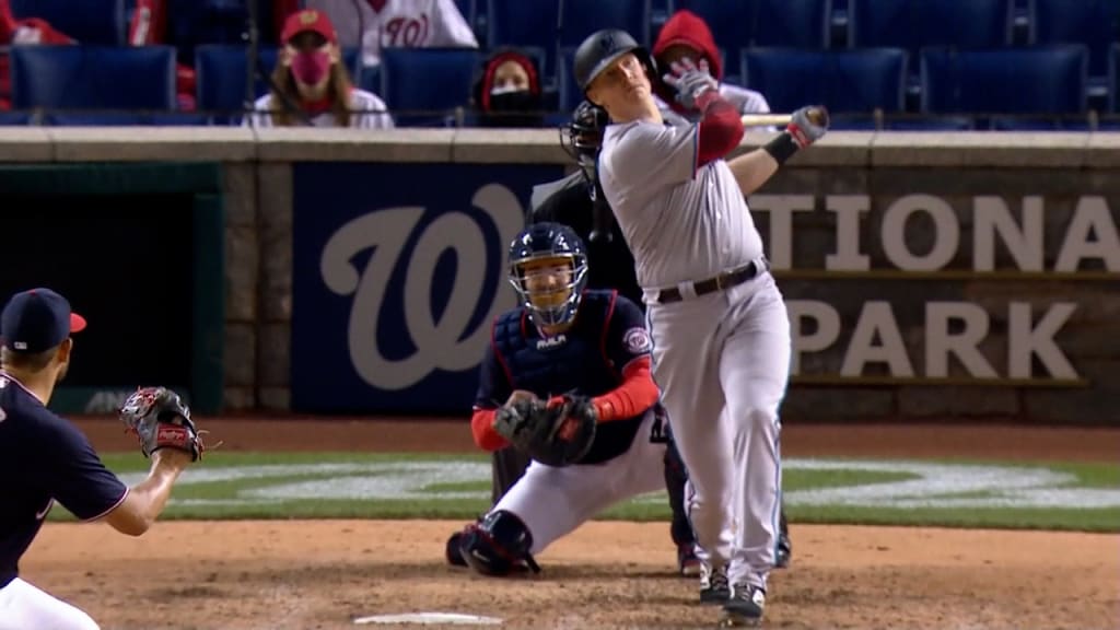 Garrett Cooper of the Miami Marlins singles during the third