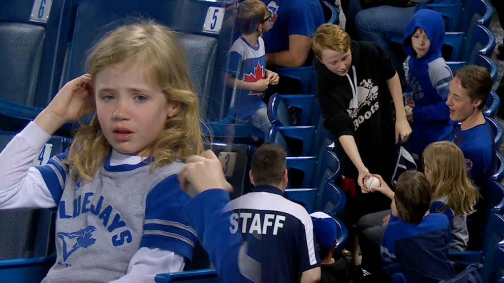 Boy gifts foul ball to girl