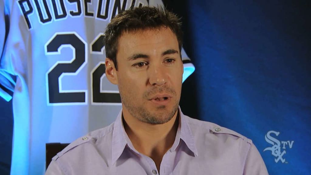 Scott Podsednik is punched by a fan while reaching for a foul ball