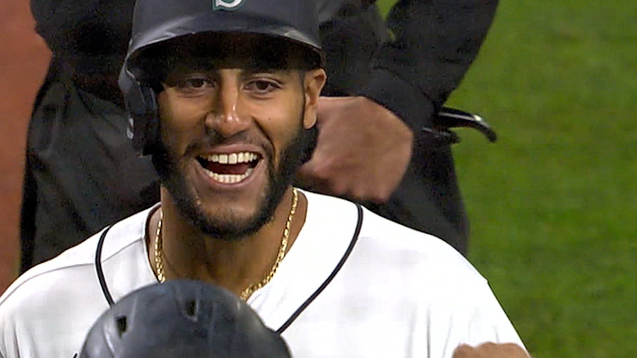 Seattle Mariners third baseman Abraham Toro, left, is late with