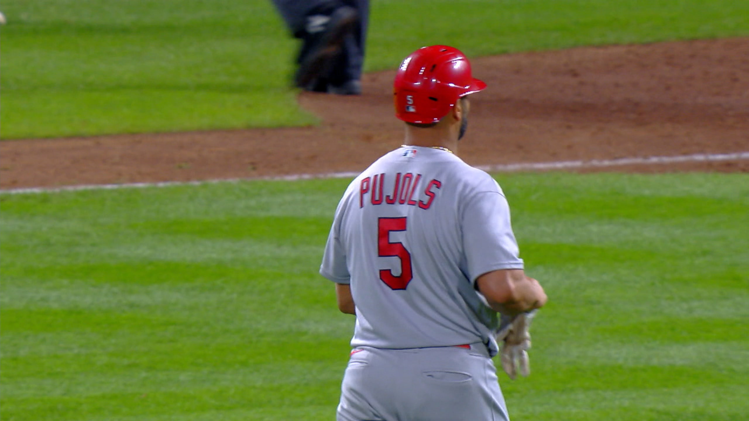 St. Louis Cardinals infielder Albert Pujols (5)holds onto his son