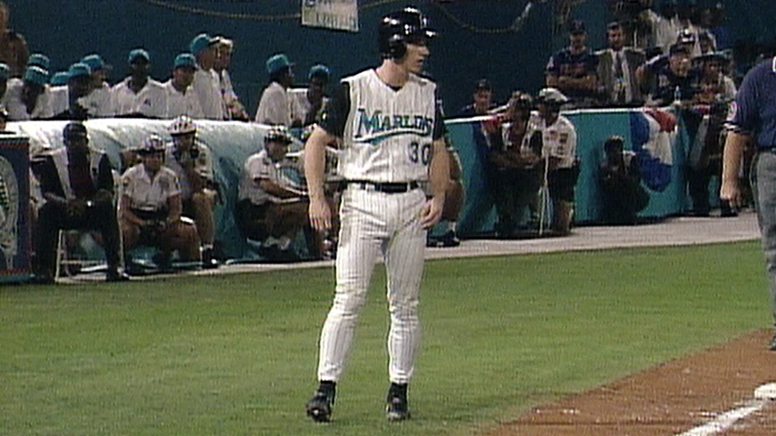 Florida Marlins' Ivan Rodriguez, left, is greeted by teammates Juan Pierre,  center, and Mike Lowell, right, after hitting a three-run home run against  Atlanta Braves pitcher Greg Maddux in the first inning