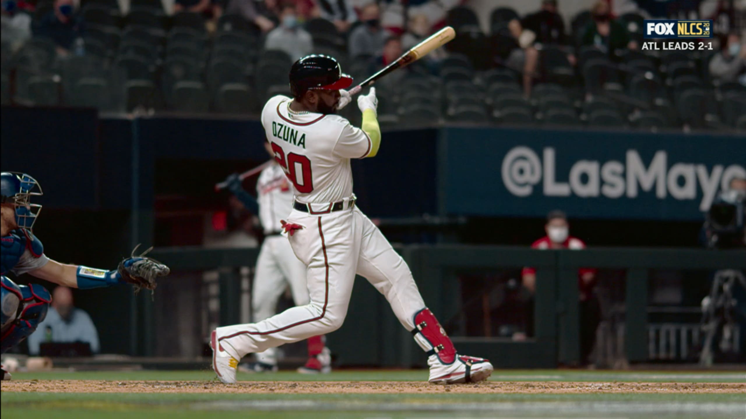 Marcell Ozuna climbs wall