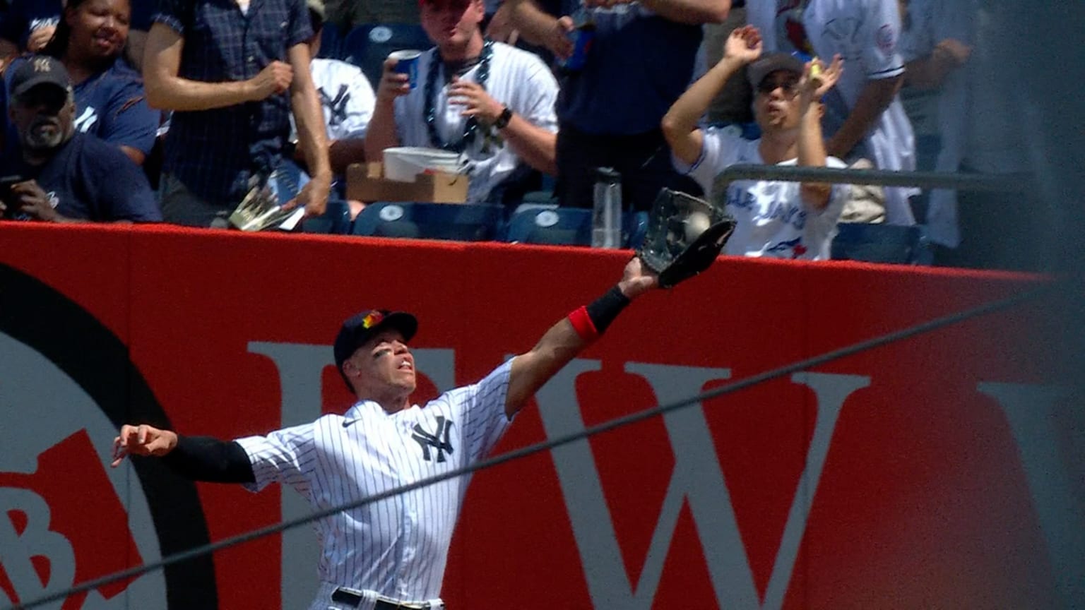 New York Yankees right fielder Aaron Judge catches a fly ball in the fourth  inning against the Chicago White Sox during a baseball game, Thursday, Aug.  12, 2021 in Dyersville, Iowa. The