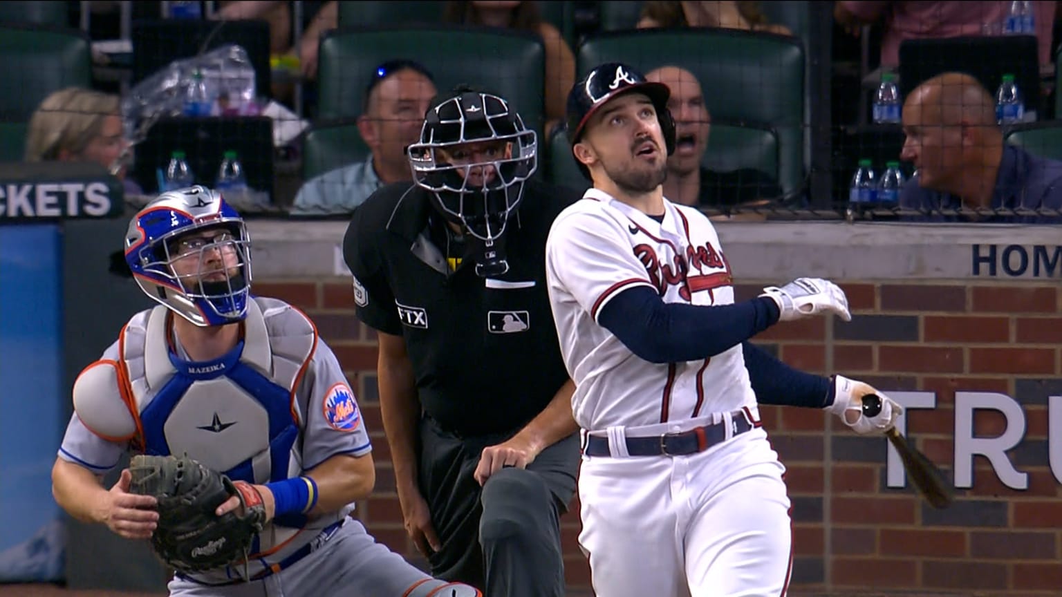 Atlanta Braves' Adam Duvall, right, celebrates his two-run home run in the  dugout during the third inning of Game 1 in baseball's World Series between  the Houston Astros and the Atlanta Braves