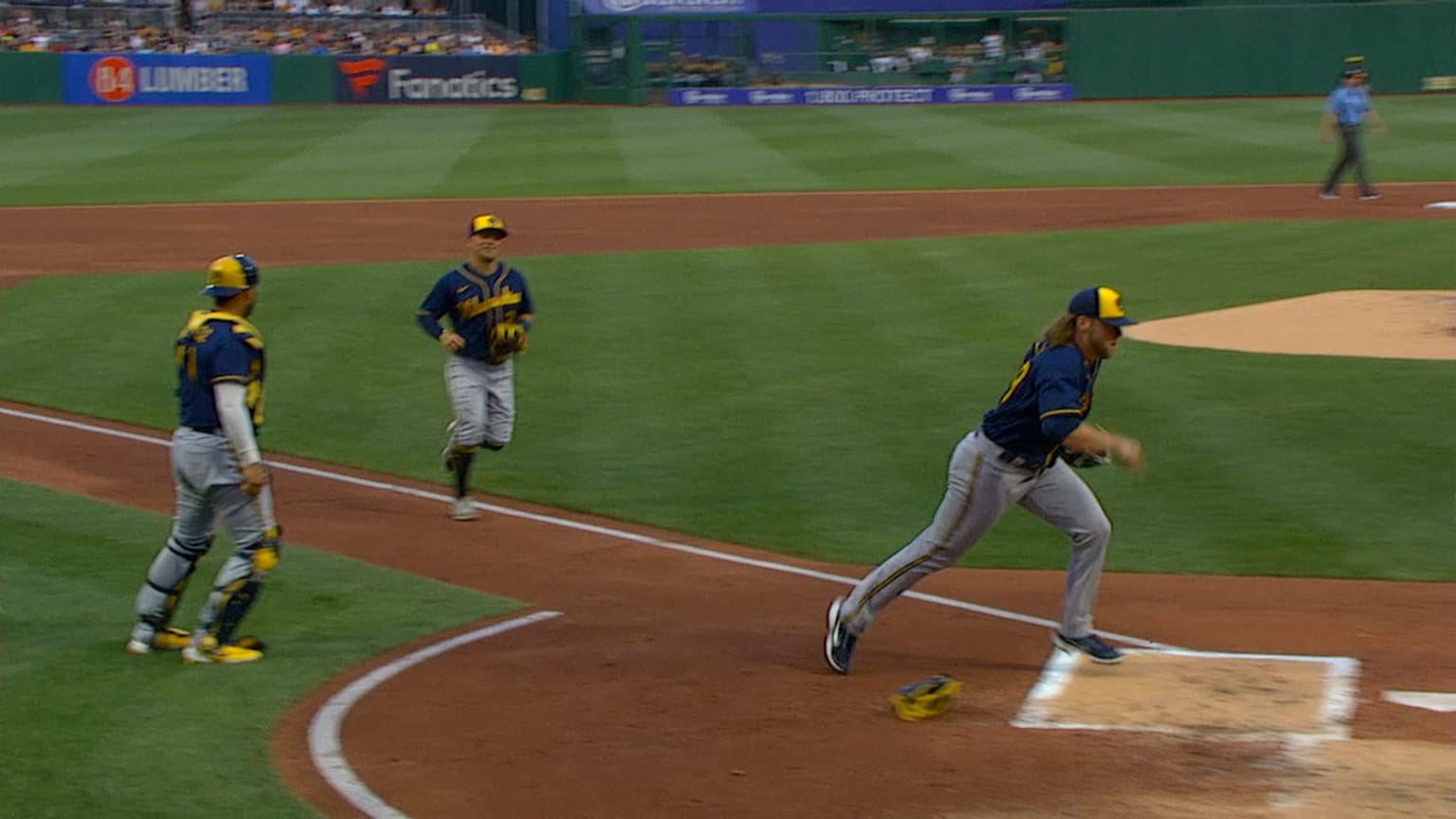 Corbin Burnes darts to the dugout 07/01/2022 Atlanta Braves