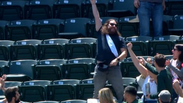 Groom catches foul ball
