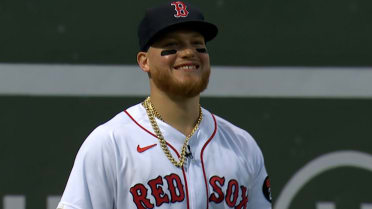 The chain of Alex Verdugo of the Boston Red Sox hangs from his