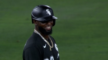 Luis Robert laughs after a tumble