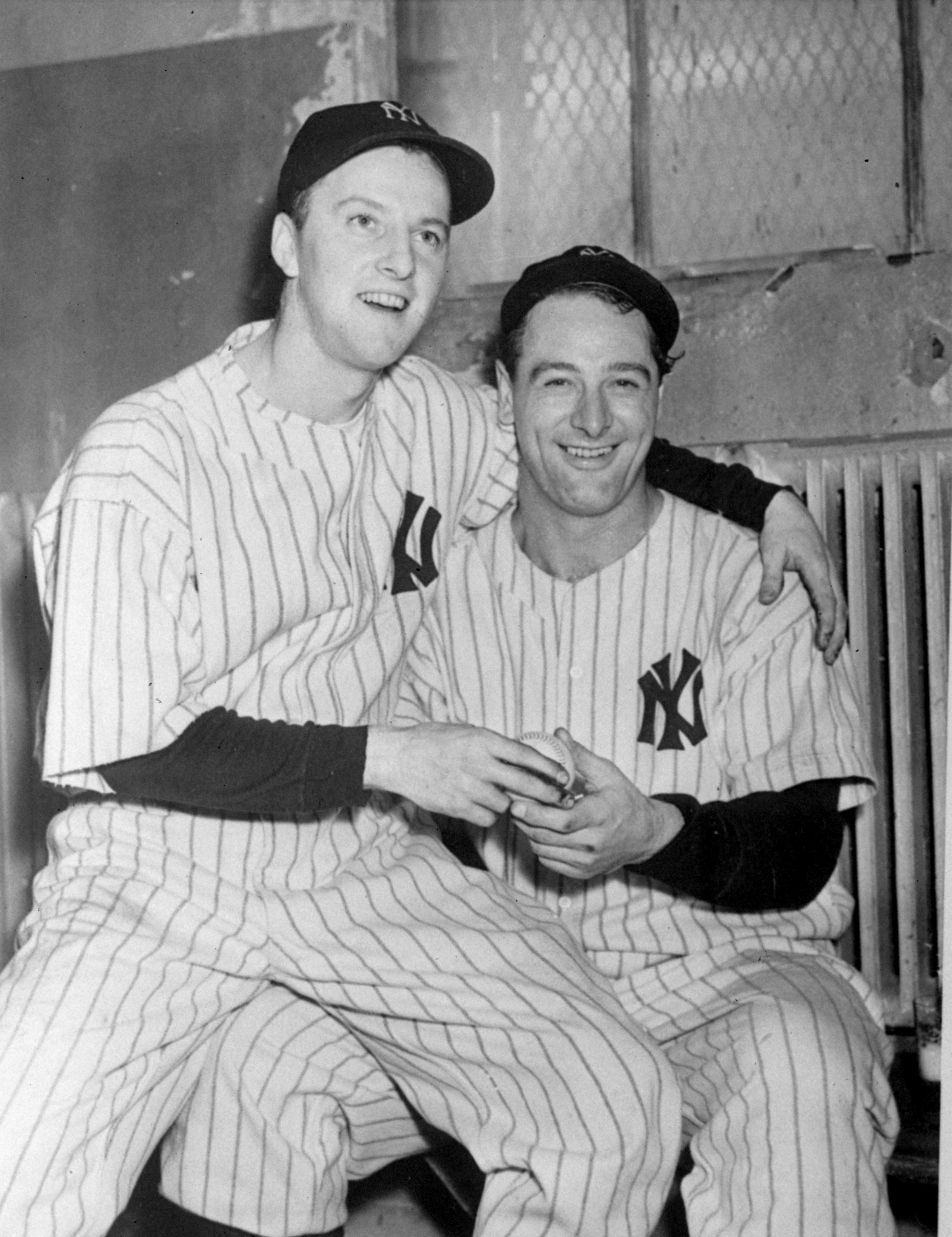 Monte Pearson sitting on Lou Gehrig's lap after winning Game 4 of the 1936 World Series. (AP)