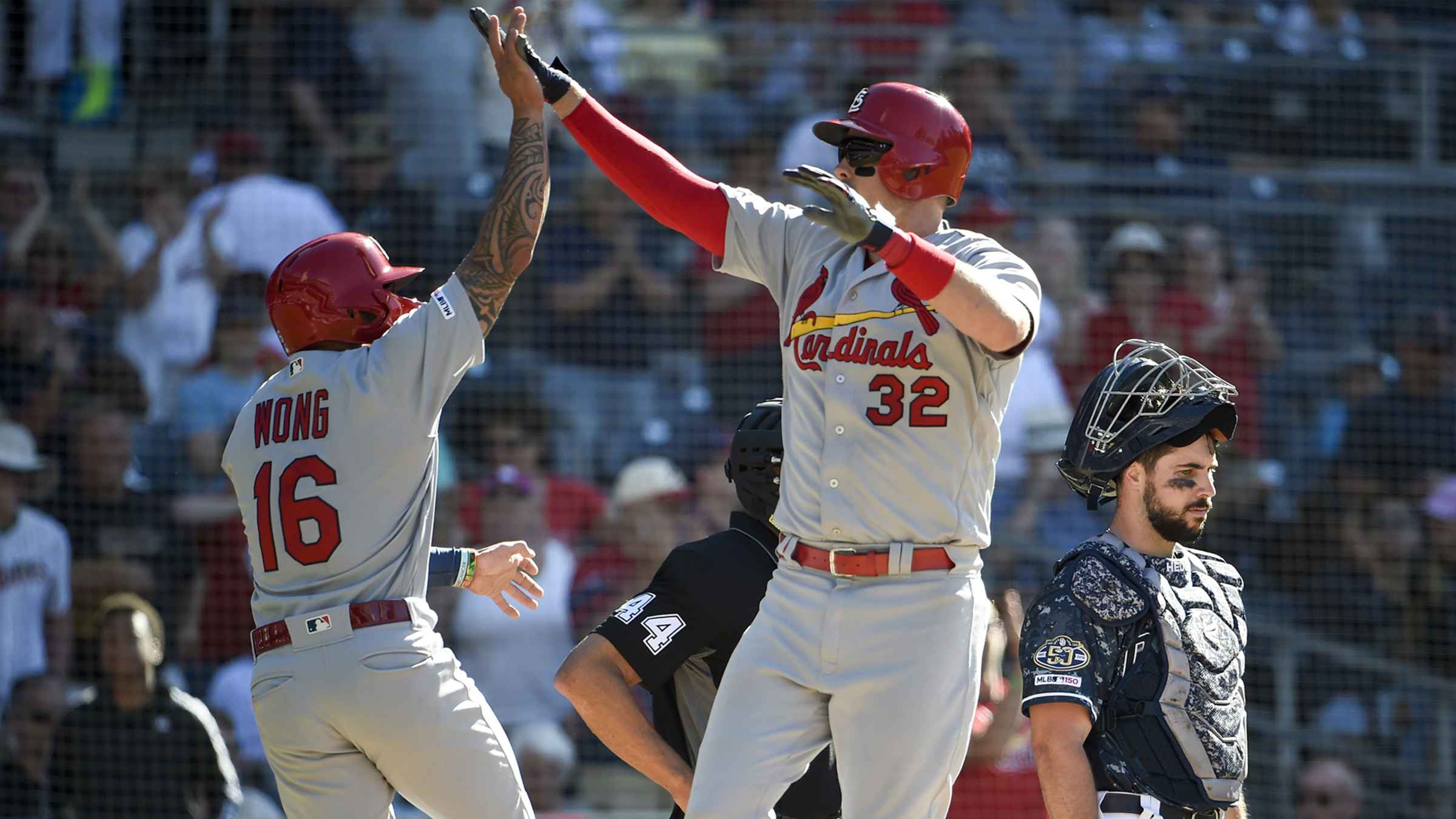 Holt sparks 8th inning rally as Reds beat Cardinals 7-4