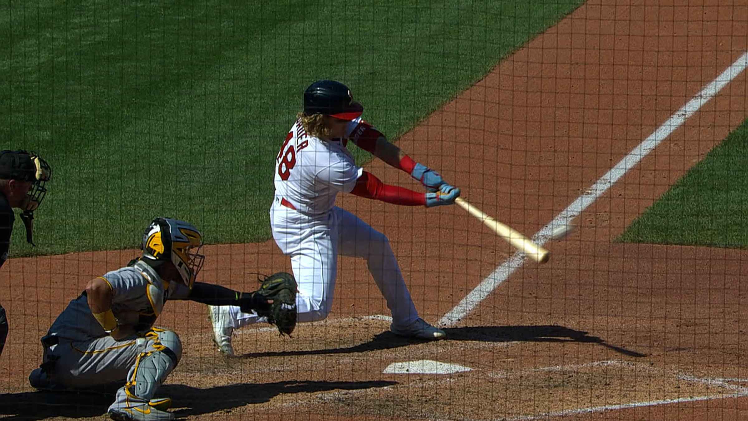 Harrison Bader of the Cincinnati Reds hits an RBI single against