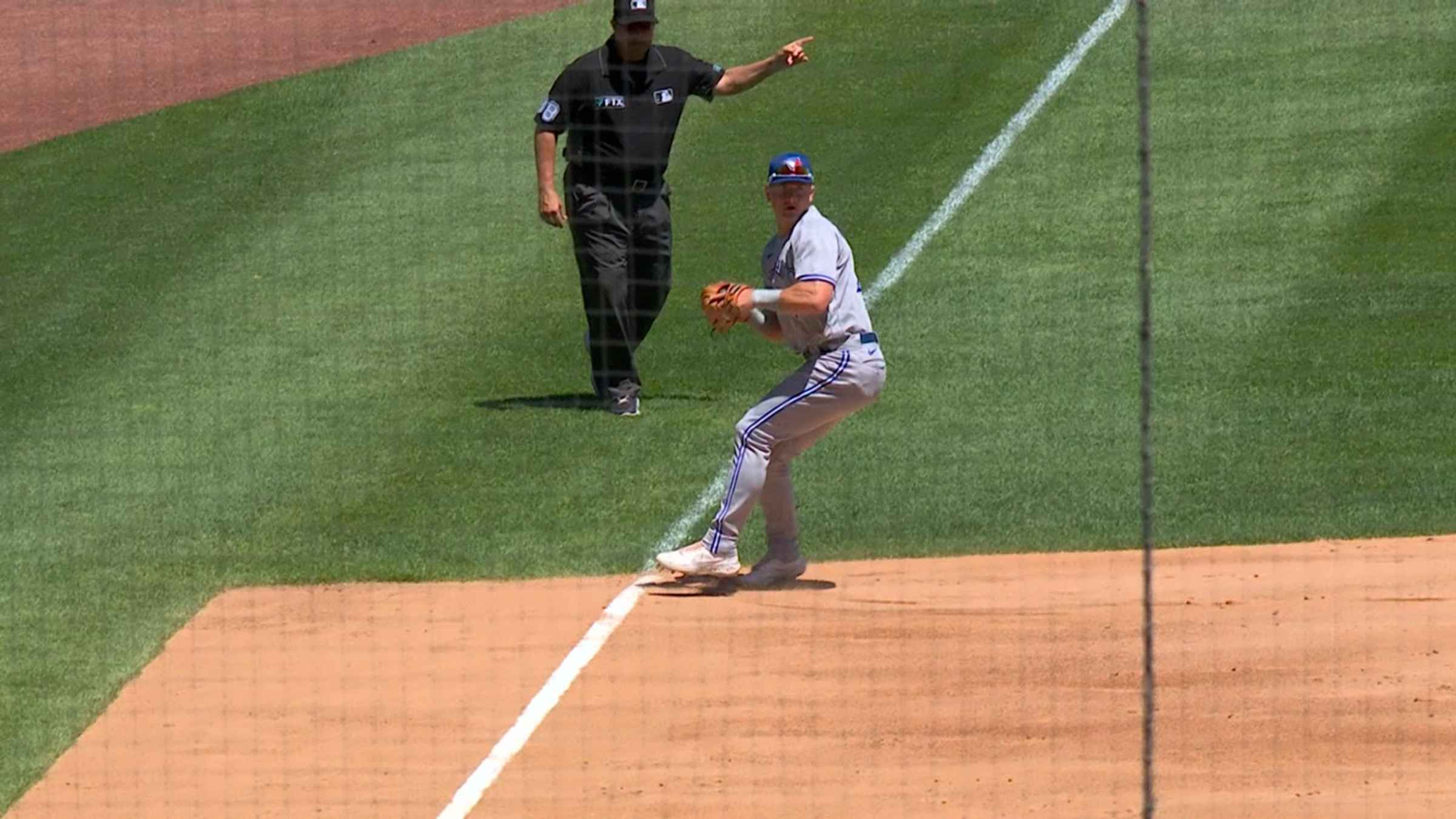 Matt Chapman of the Oakland Athletics throws to first base off