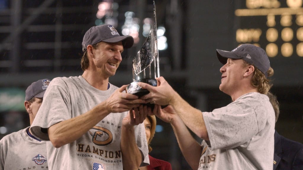 4 Nov 2001: Co-MVP winners Randy Johnson #51 and Curt Schilling #38 of the Arizona Diamondbacks hold the trophys after game seven of the Major League Baseball World Series at Bank One Ballpark in Phoenix, Arizona. The Diamondbacks won 3-2 to capture the World Series title. DIGITAL IMAGE. Mandatory Credit: Harry How/ALLSPORT
