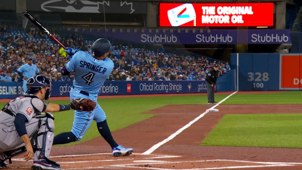 George Springer of the Toronto Blue Jays looks on from the dugout