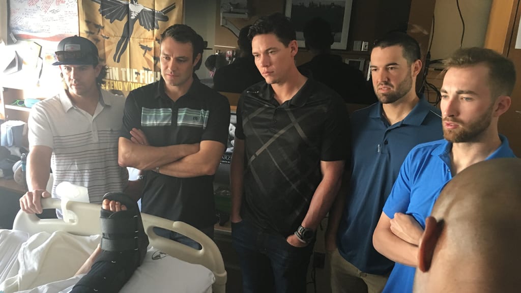 Tuffy Gosewisch, A.J. Pollock, Peter O'Brien, Robbie Ray and Steve Hathaway visit with a patient. (Josh Rawitch / Arizona Diamondbacks)